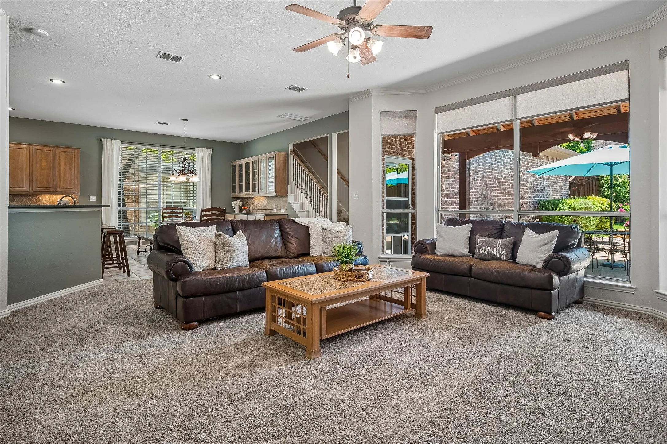 Family room looking into breakfast room. Outside is long, covered patio.