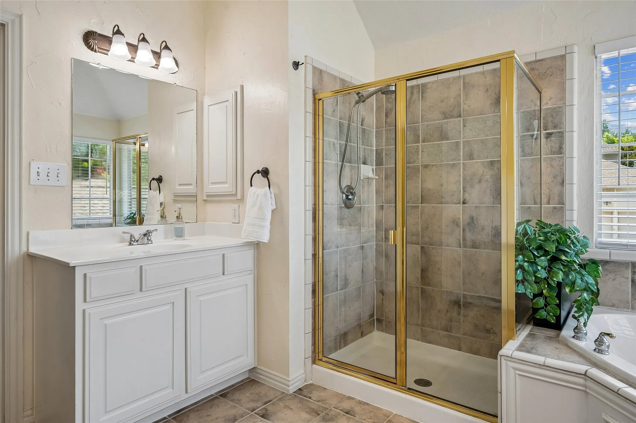 Vanities both have medicine cabinets, perfect for organizing and keeping counters clean.