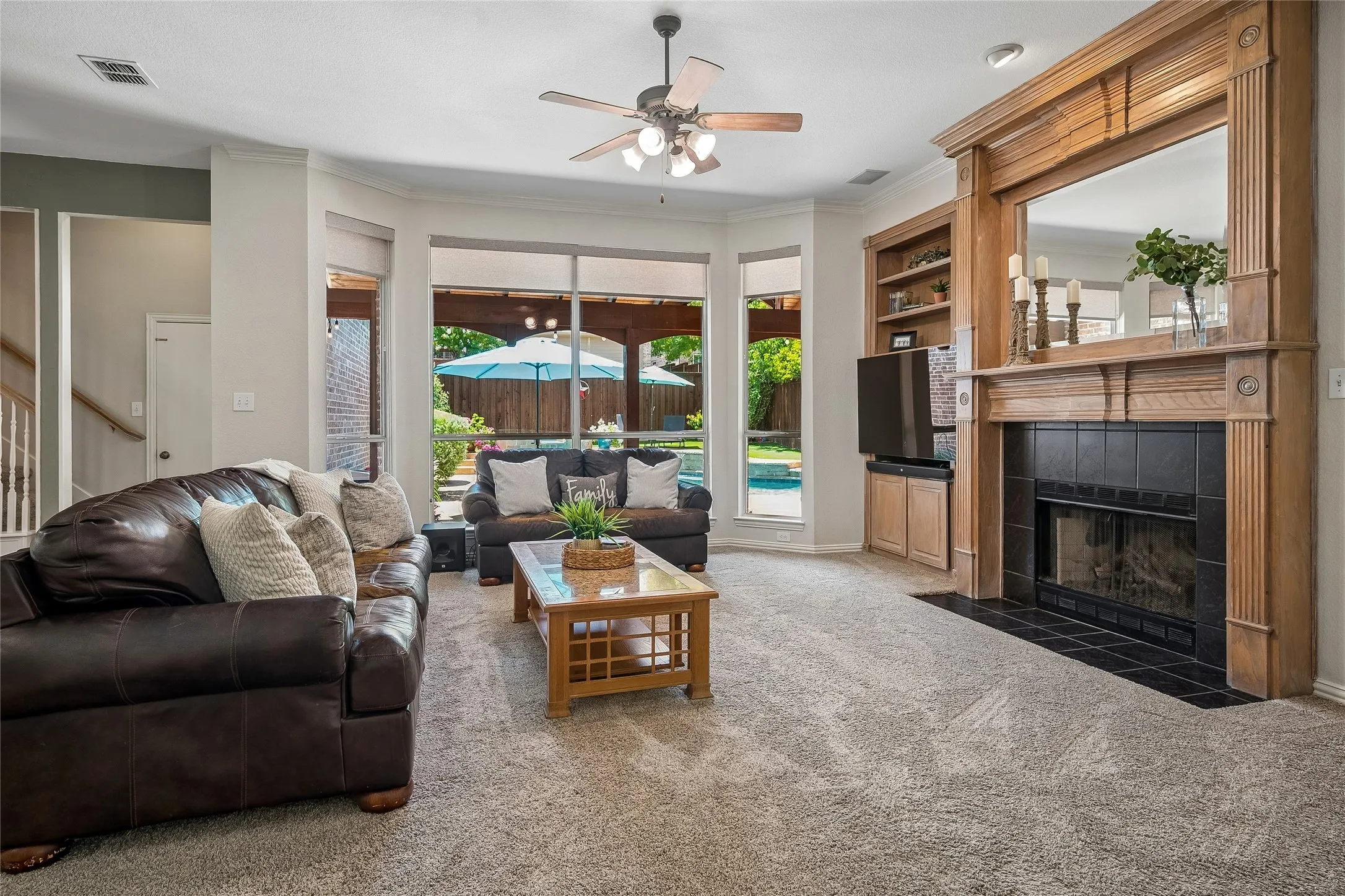 Family room has extended windows that face beautiful backyard.