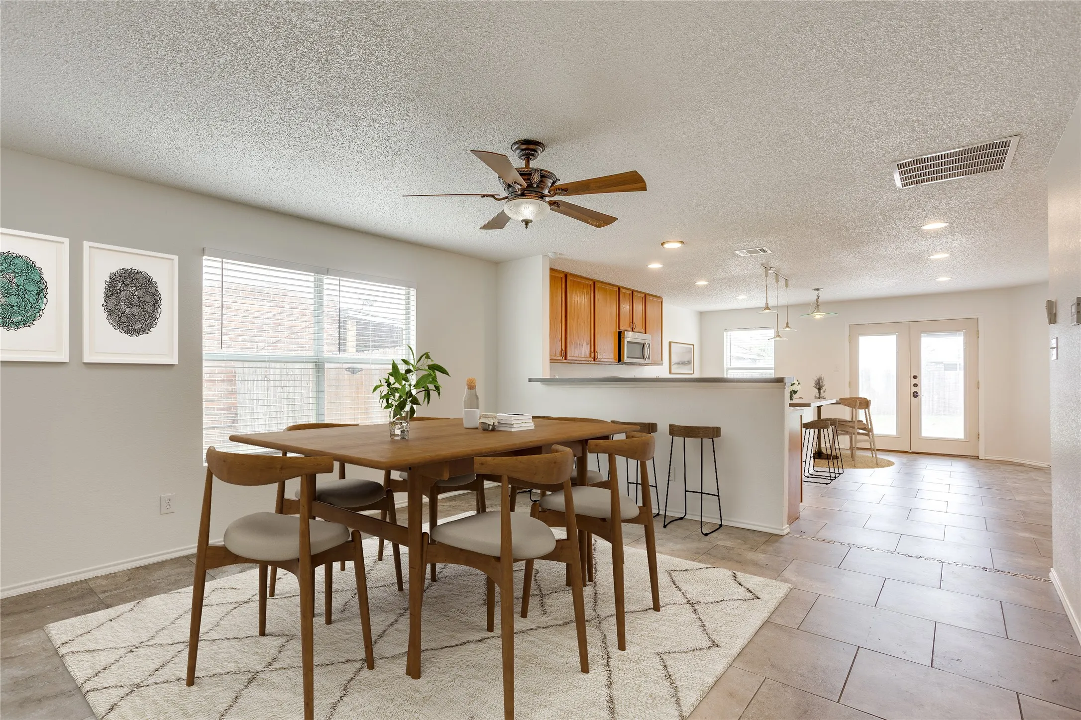 Virtually staged dining area and eating bar.