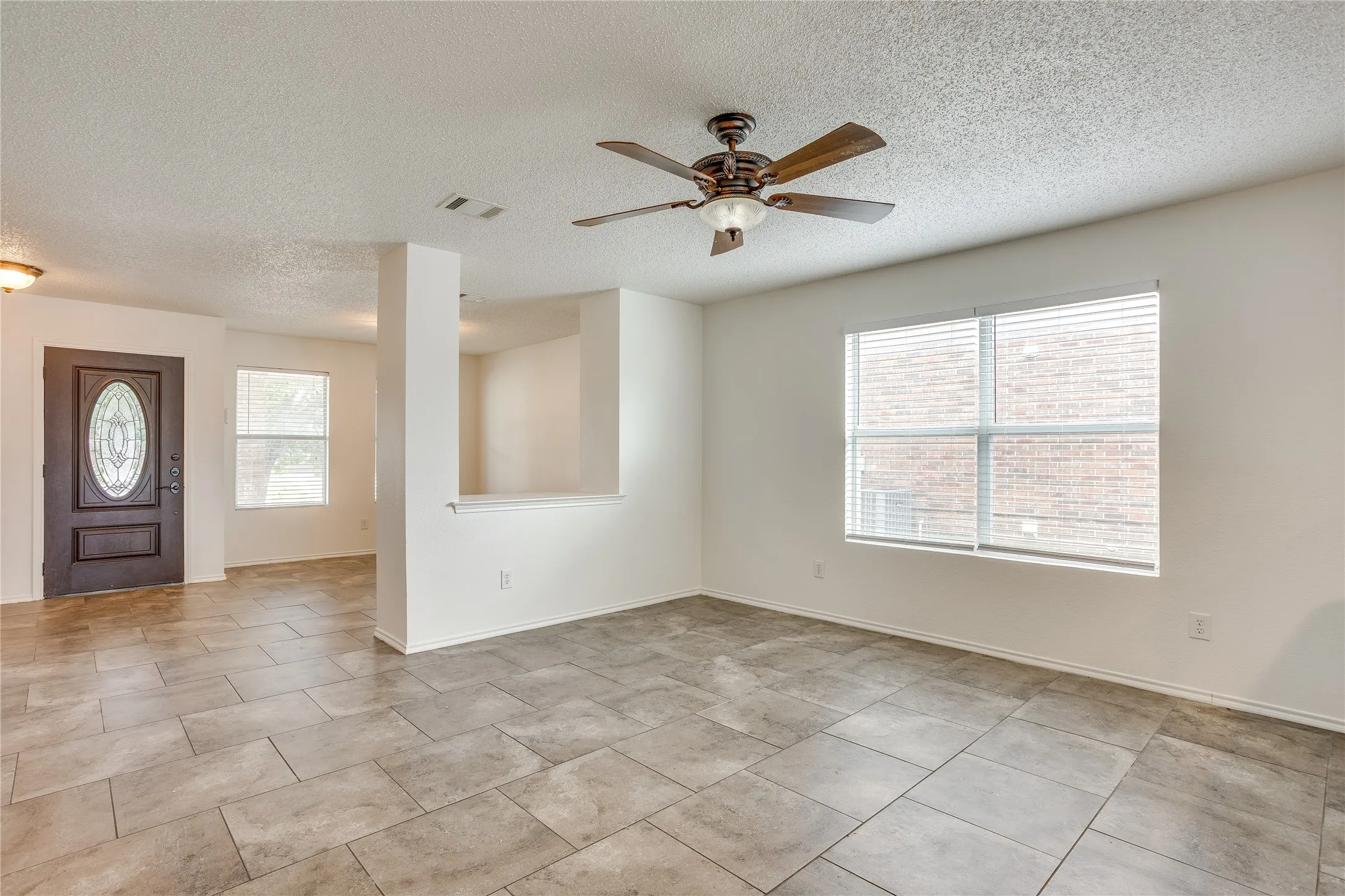 Open concept living space without virtually staged furniture
