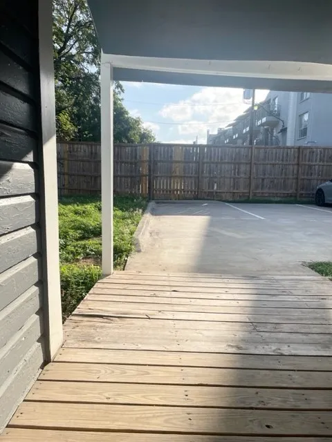 Wood-finish plank decking with a covered porch entry