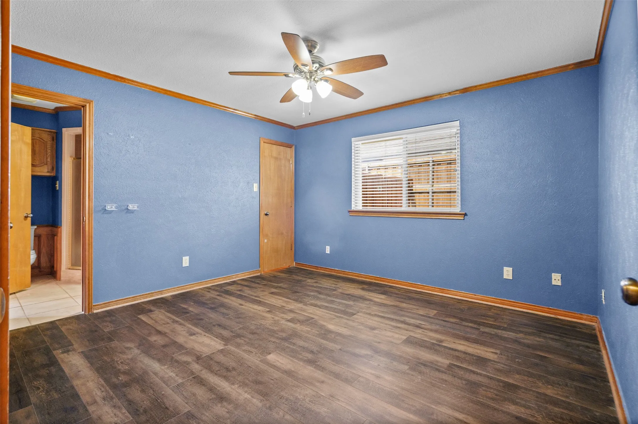 Bedroom 3 on opposite side of the home with its own full bathroom