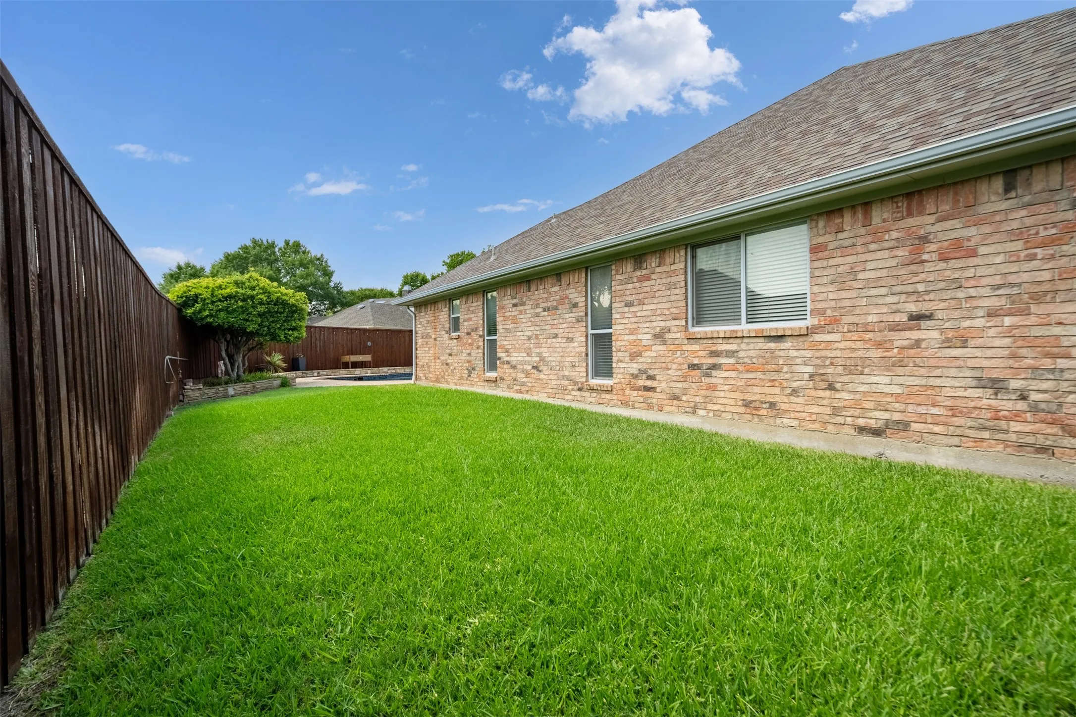 Huge backyard space with grass