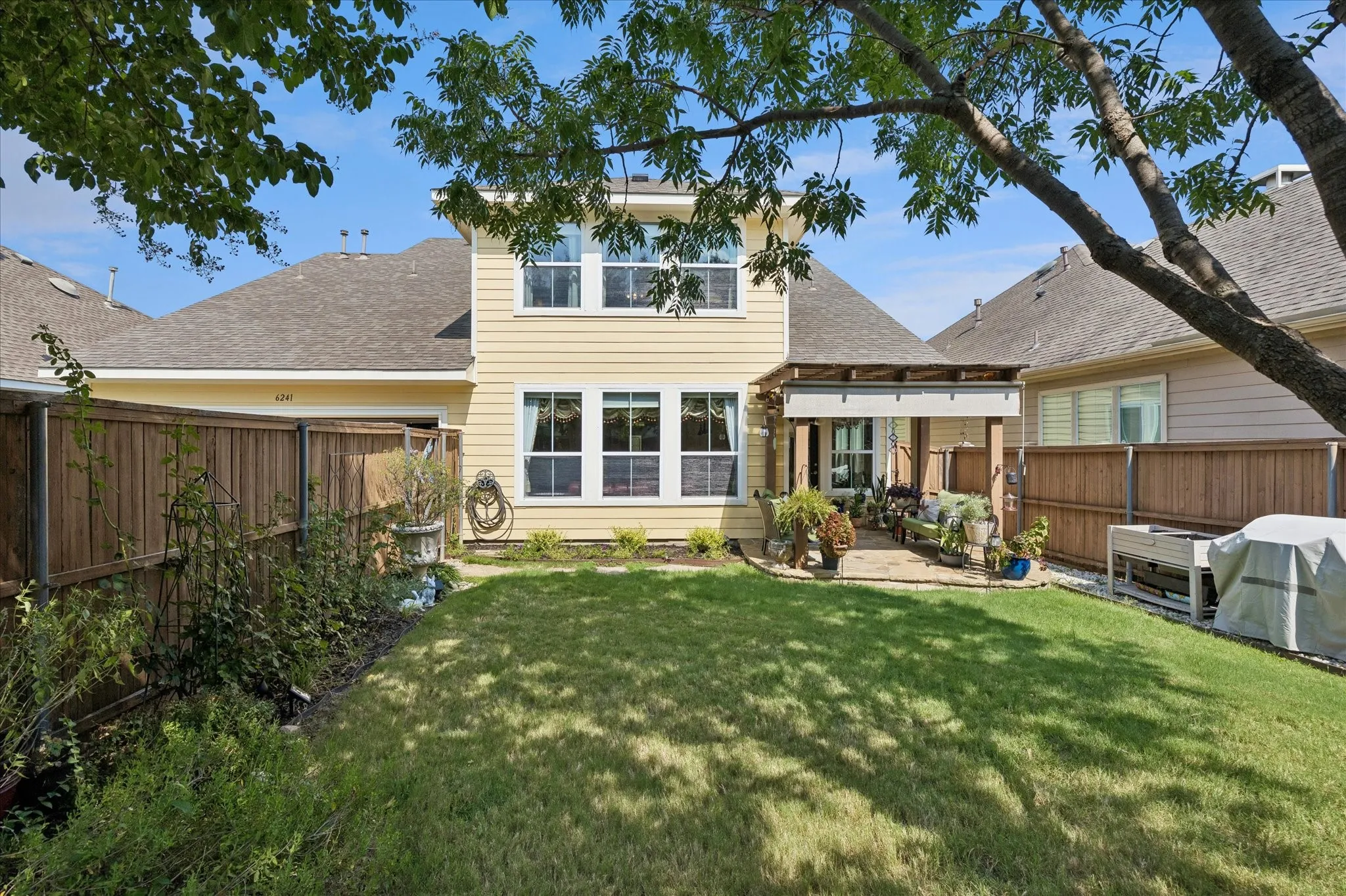 Great sized backyard sheltered from the garage with the only driveway that will fit 4 extra cars plus 2 in the garage. Plenty of parking.
