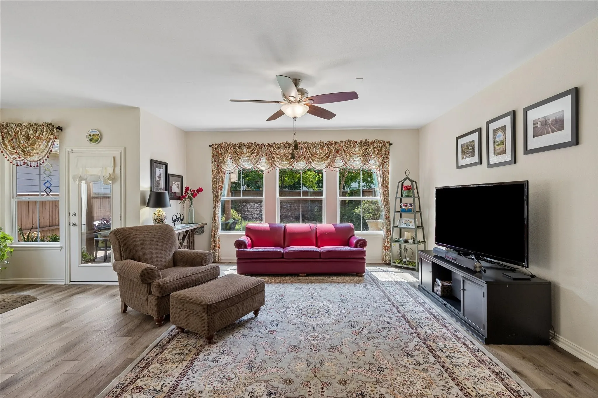 Lovely view of the beautiful backyard from the family room. Plenty of natural light.