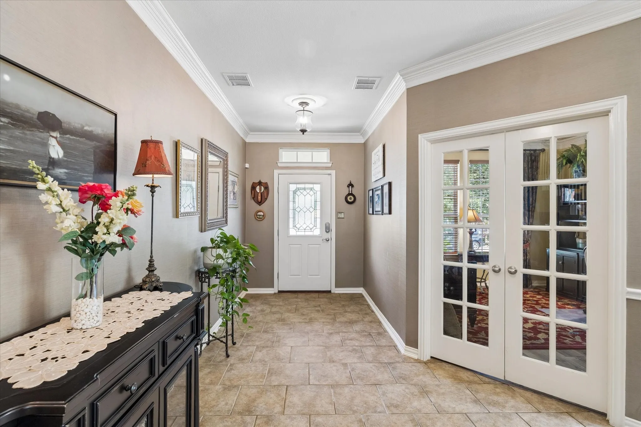 Spacious entry greets your guests in luxury.