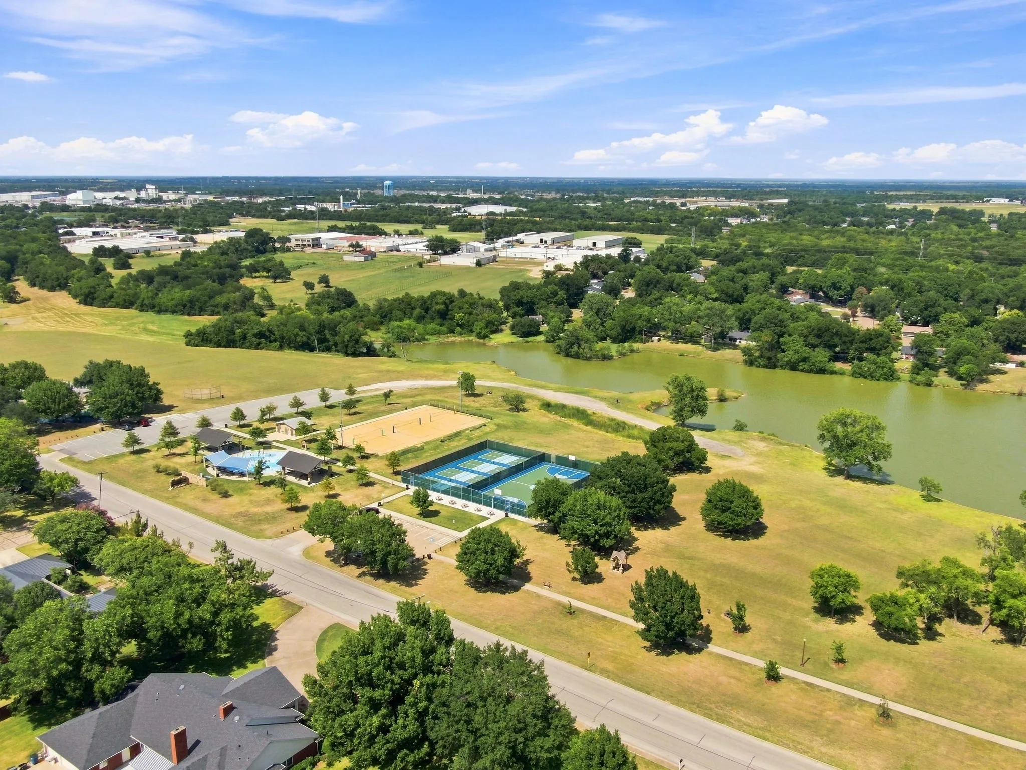 Aerial perspective showcasing a residential community with recreational amenities