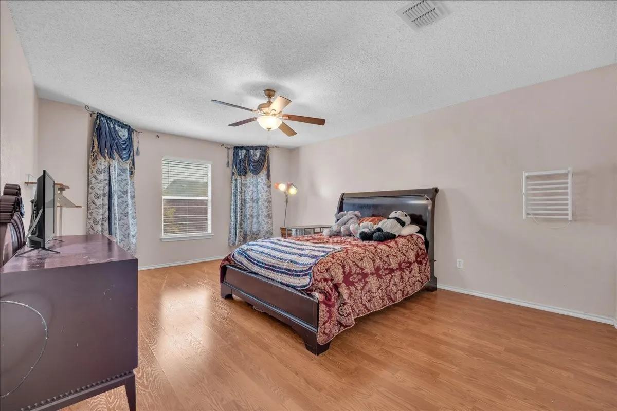 Light wood-finish flooring with neutral wall tones