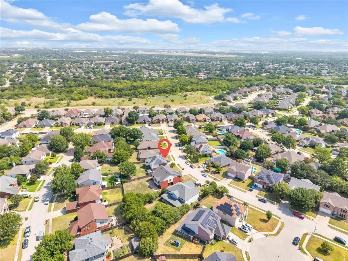 Residential neighborhood with diverse home styles and abundant mature trees