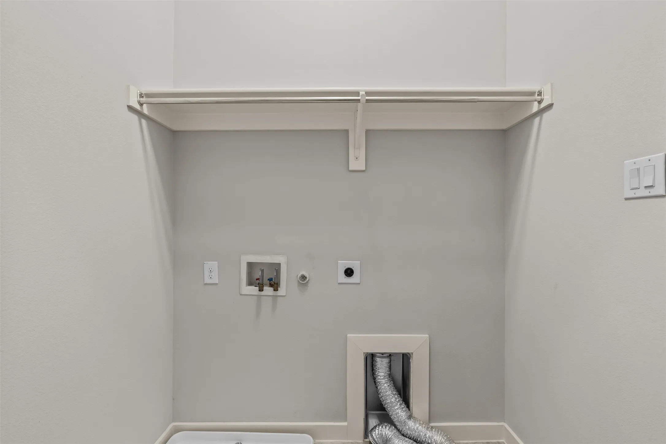 Upstairs laundry accommodates full size washer and dryer