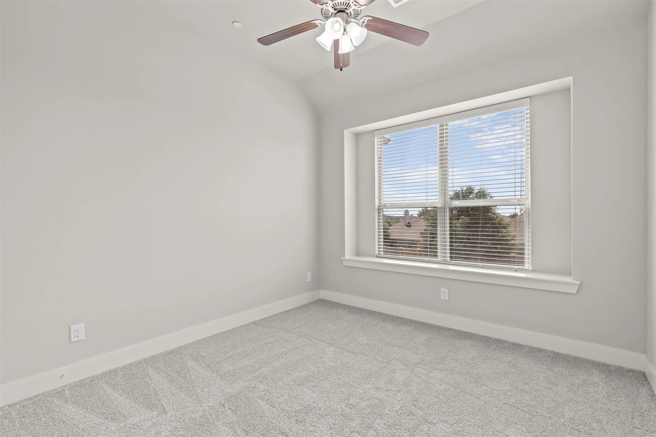Second bedroom features new carpet, ceiling fan and large closet