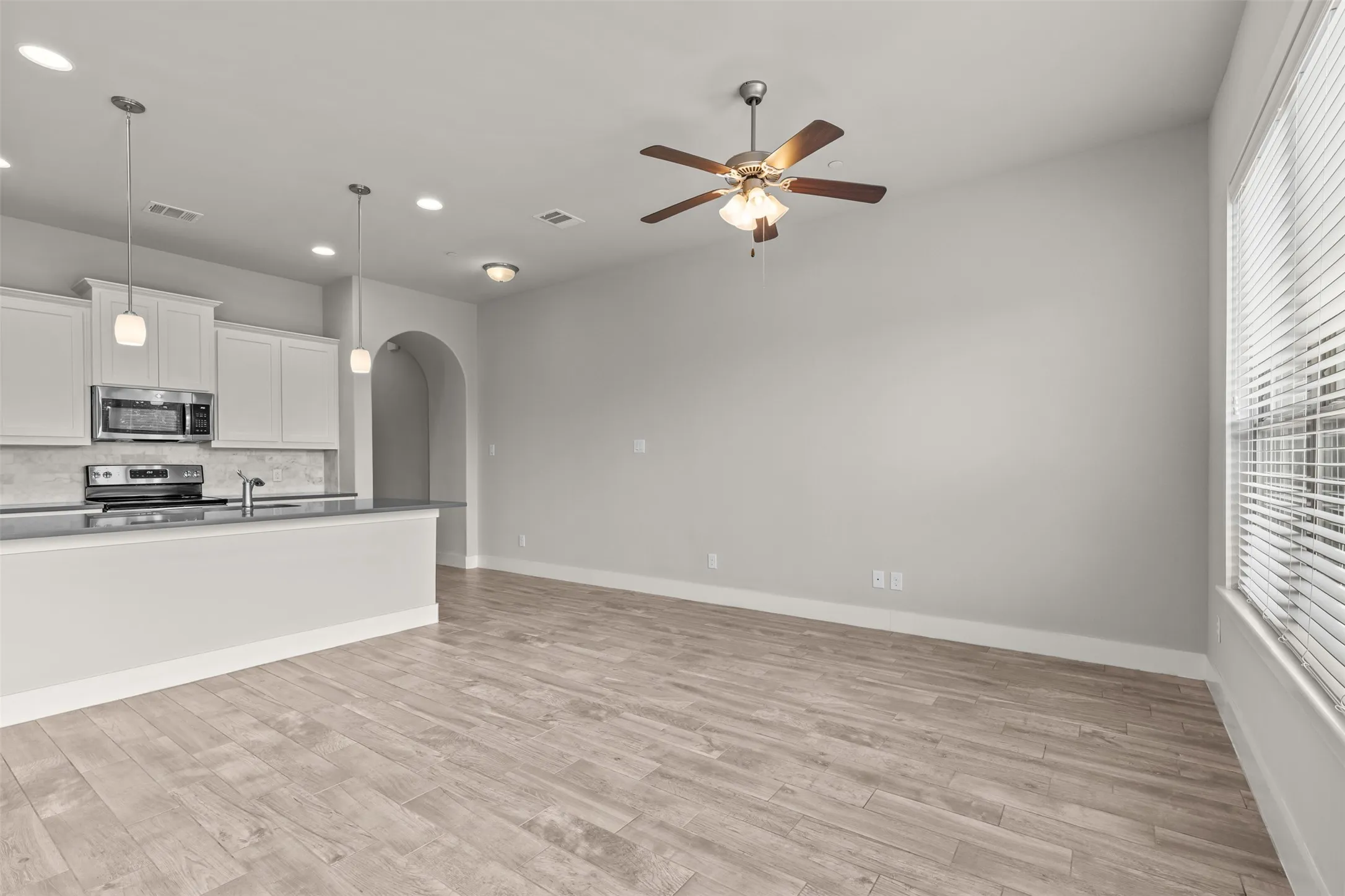 Flooring is a wood-look tile throughout the entire bottom floor