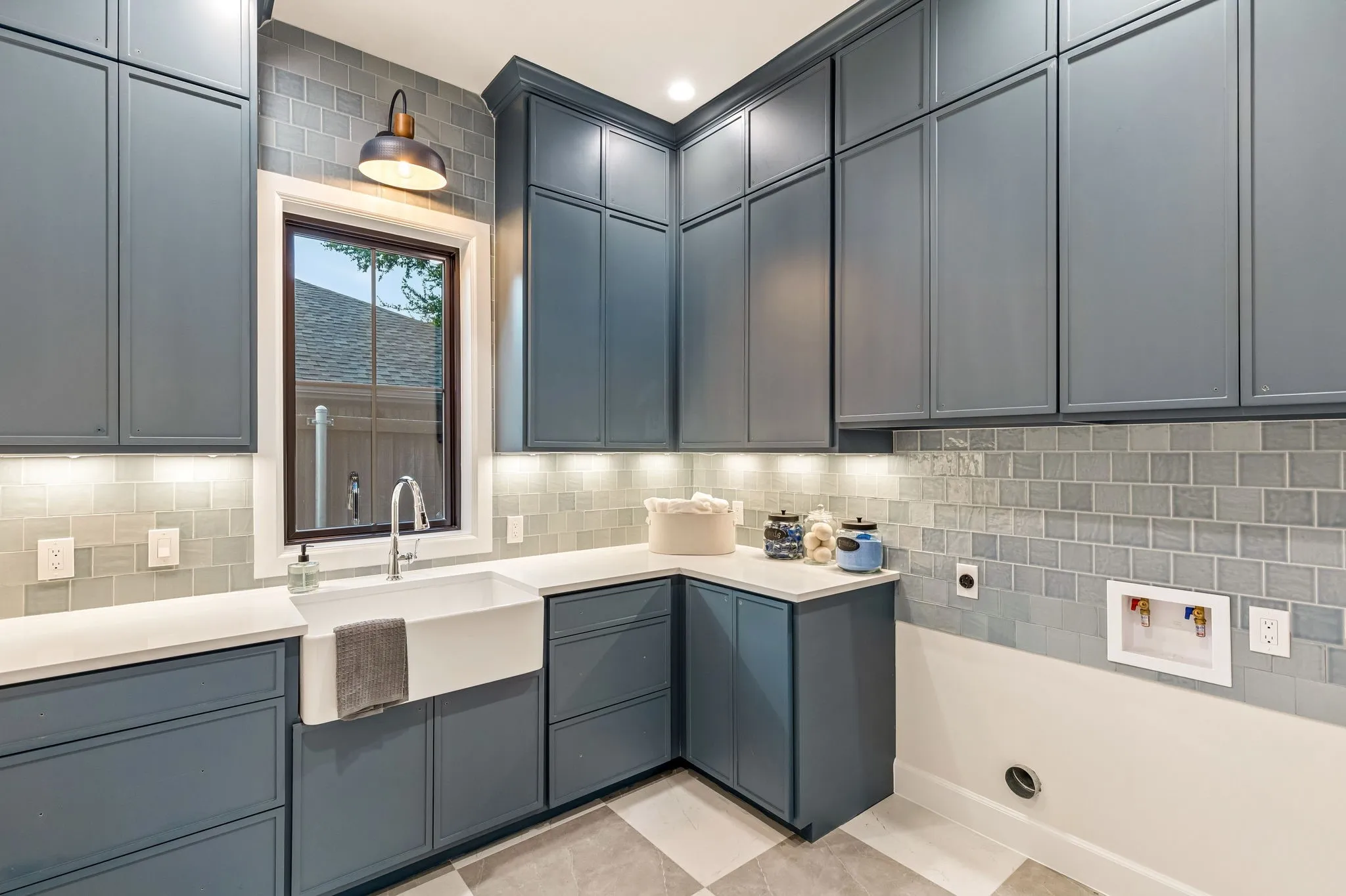 Large Utility closet/laundry room with custom cabinetry