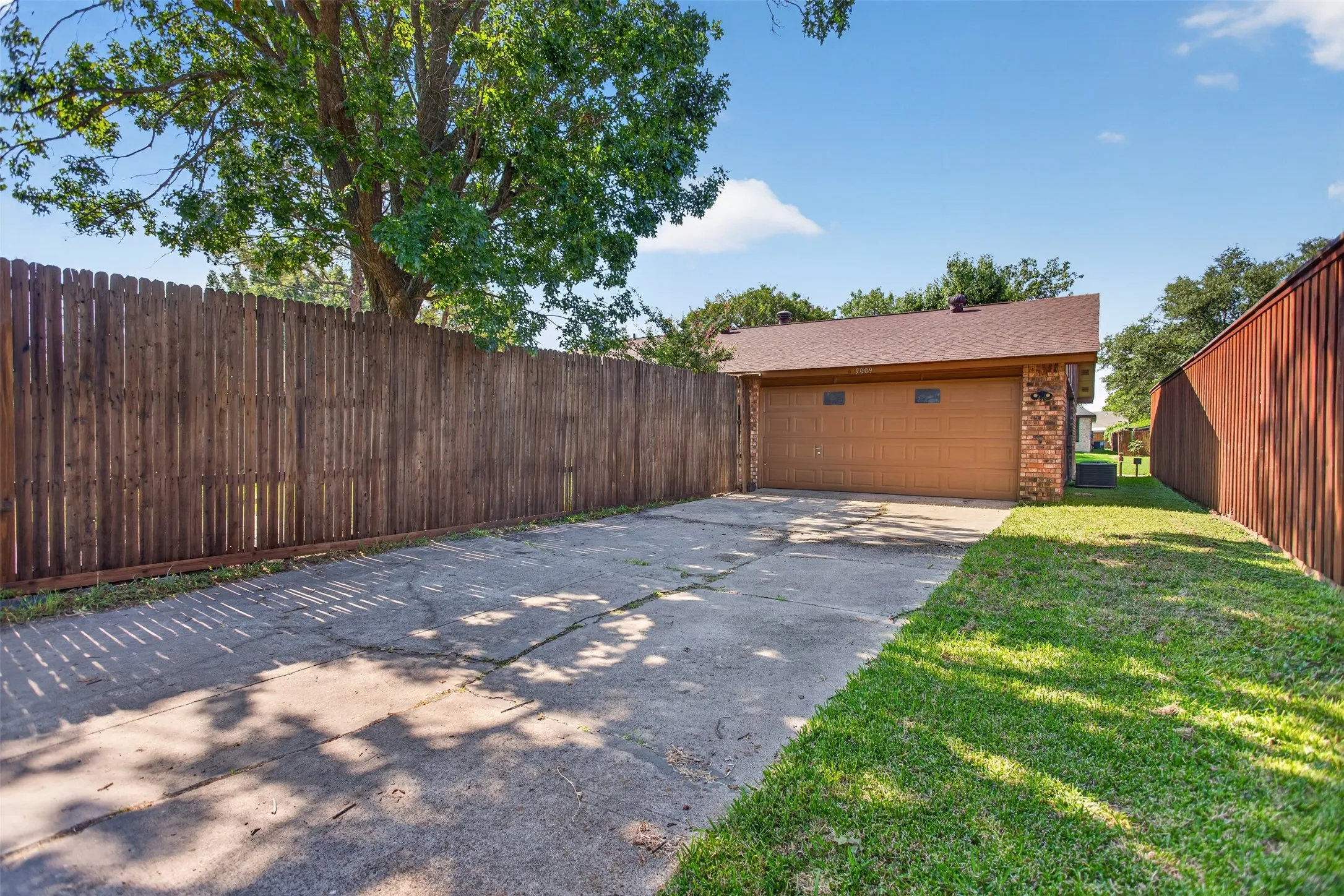 Back alleyway to long driveway into 2 car garage
