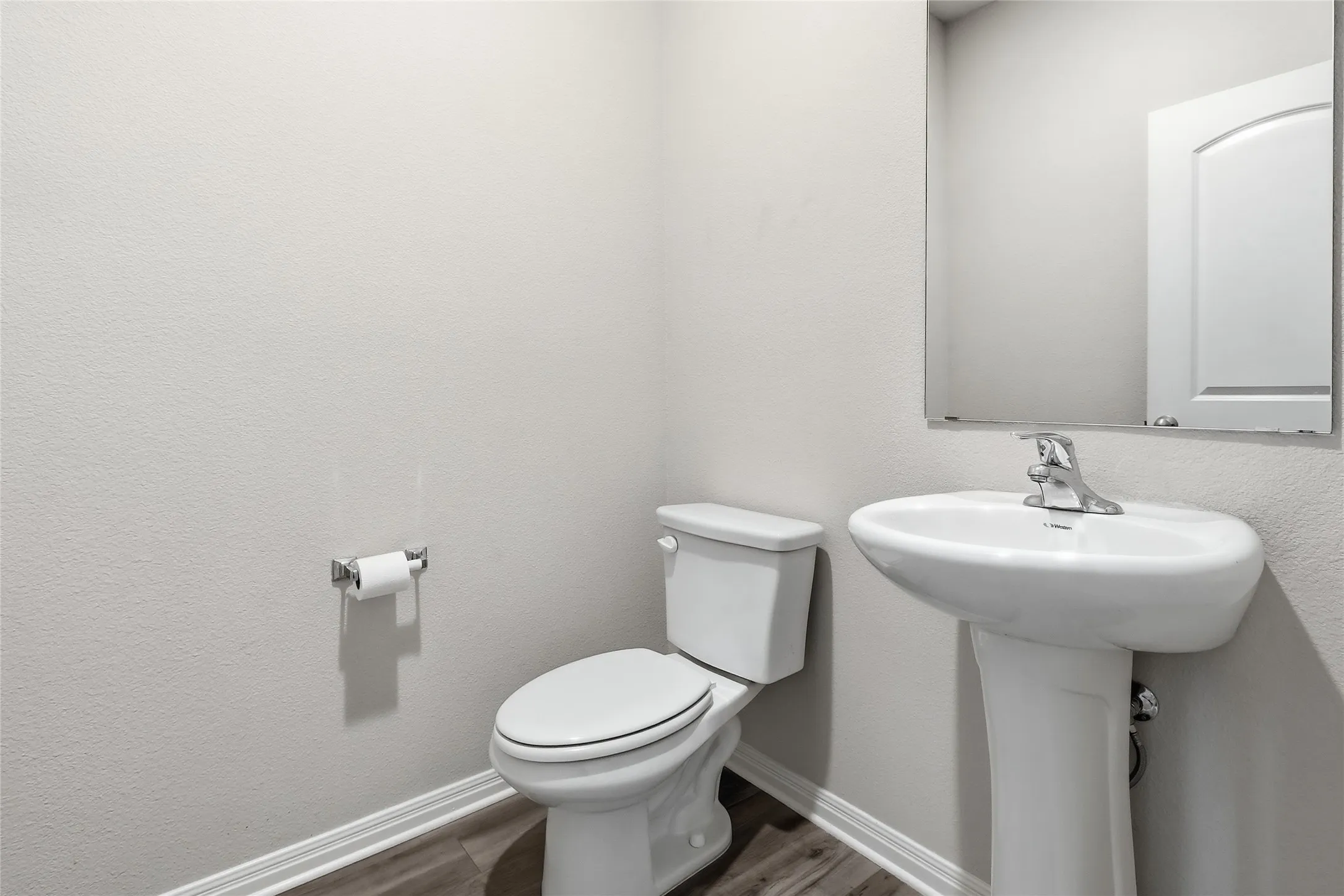 Pedestal sink with chrome faucet