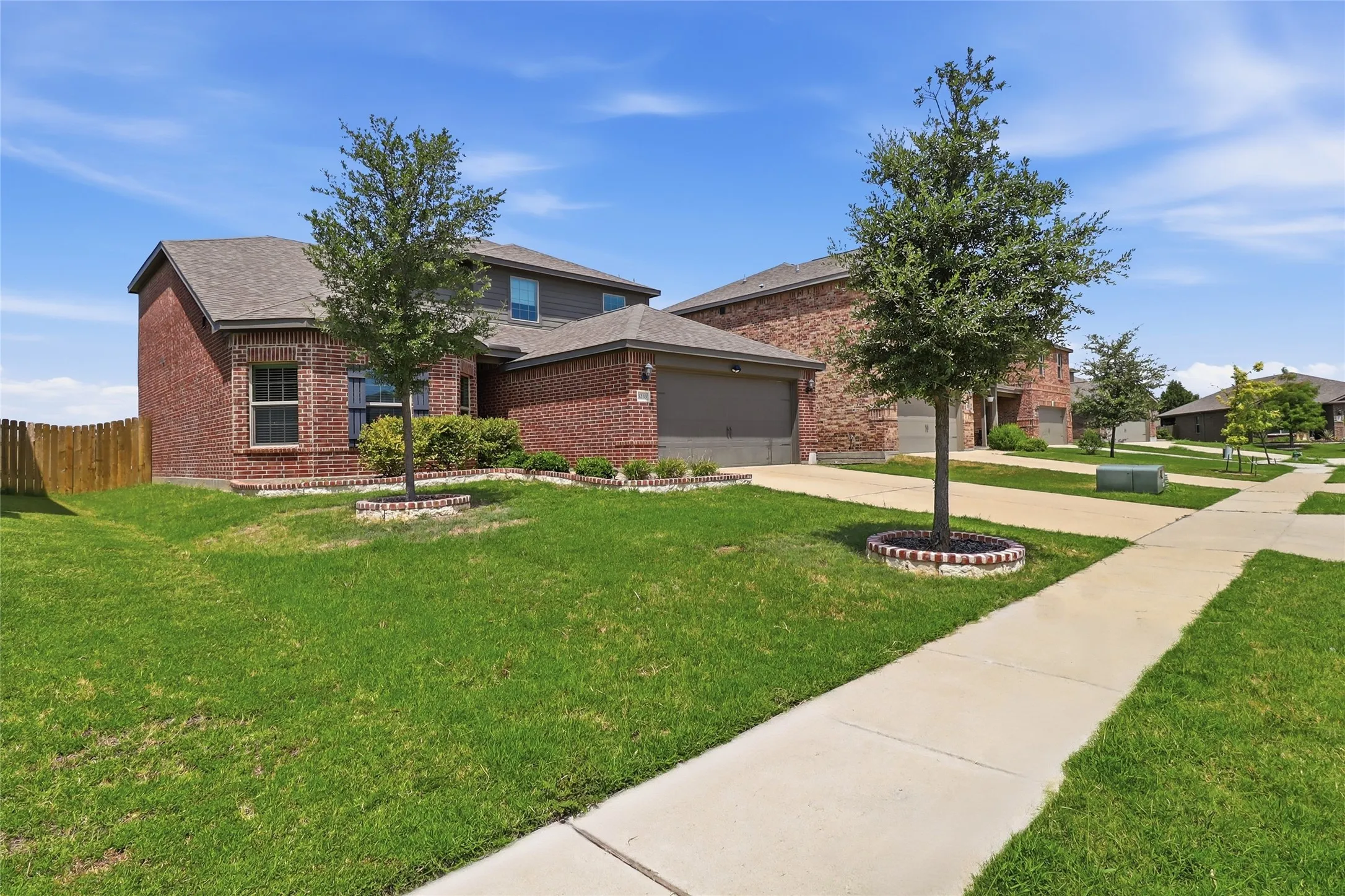 Brick veneer exterior with a two-car garage