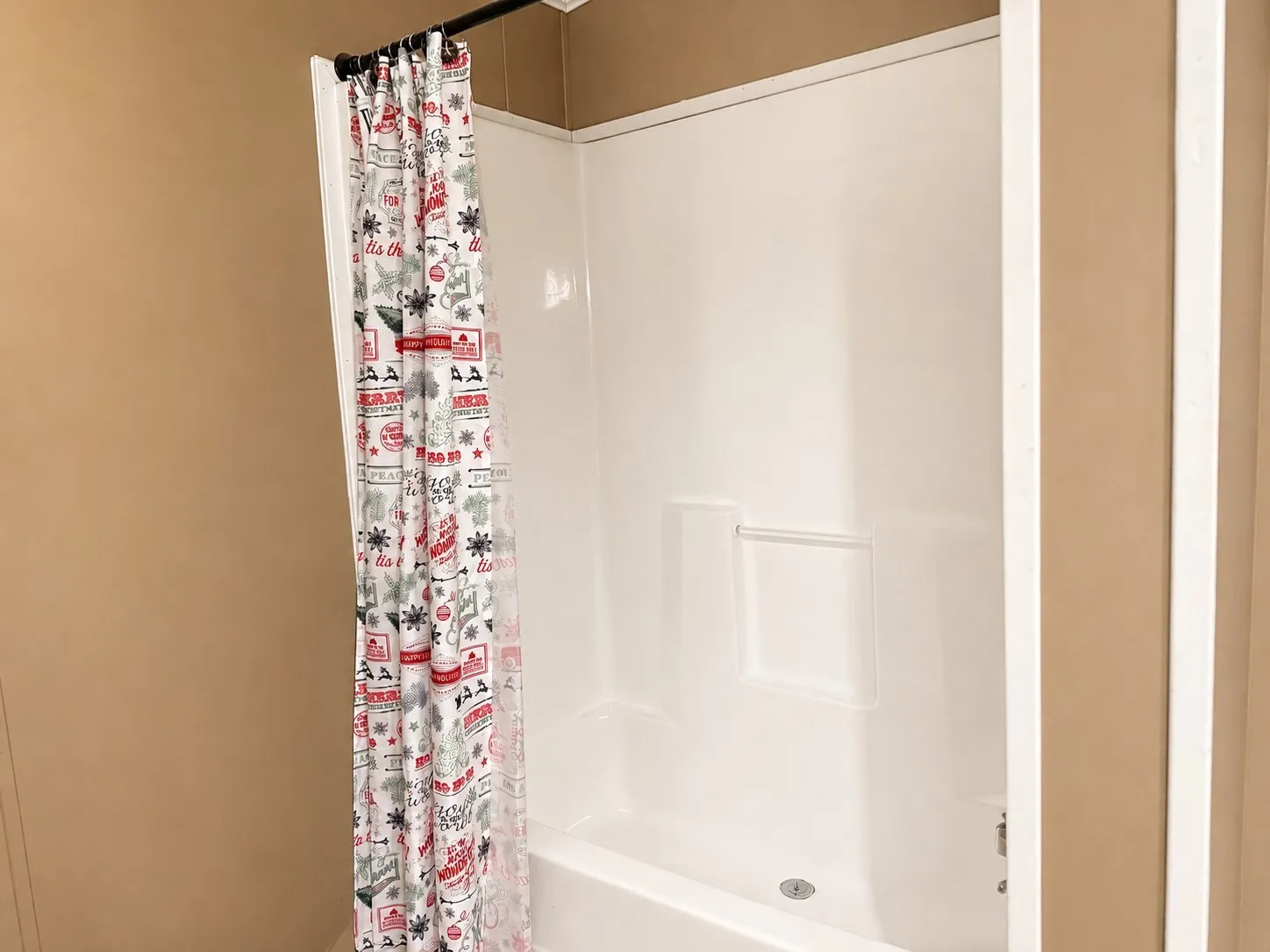 White bathtub and shower combination unit
