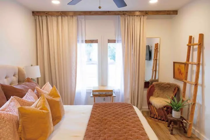 Recessed lighting illuminates wood-finish flooring