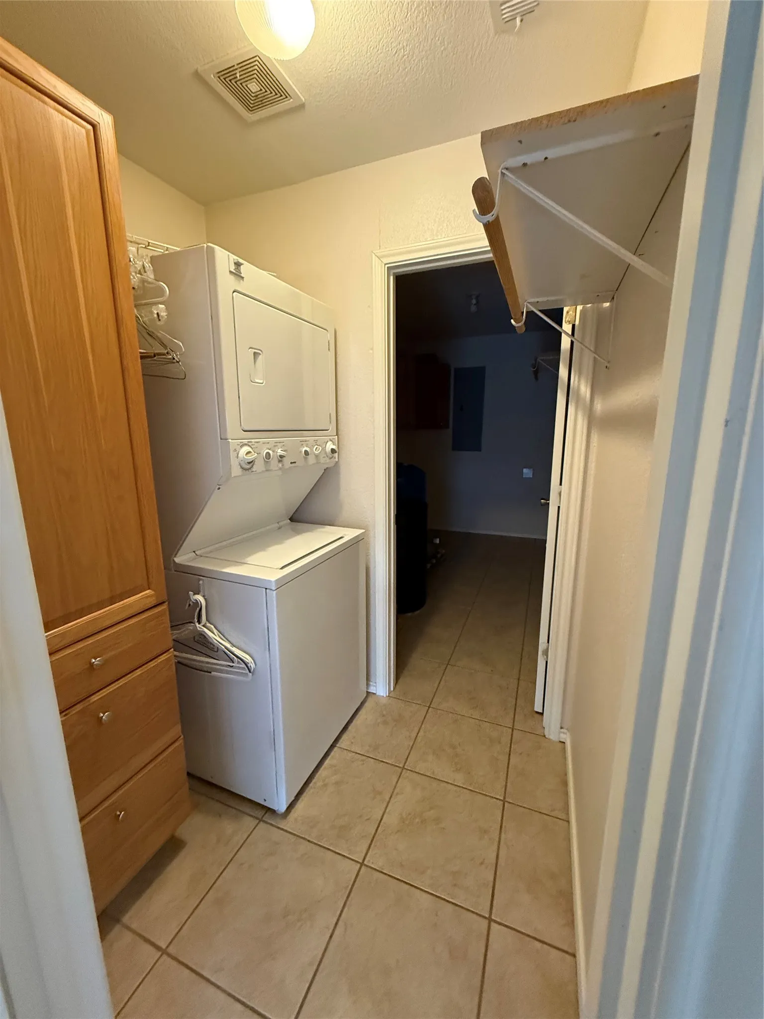 Laundry with stackable WD and walk in pantry