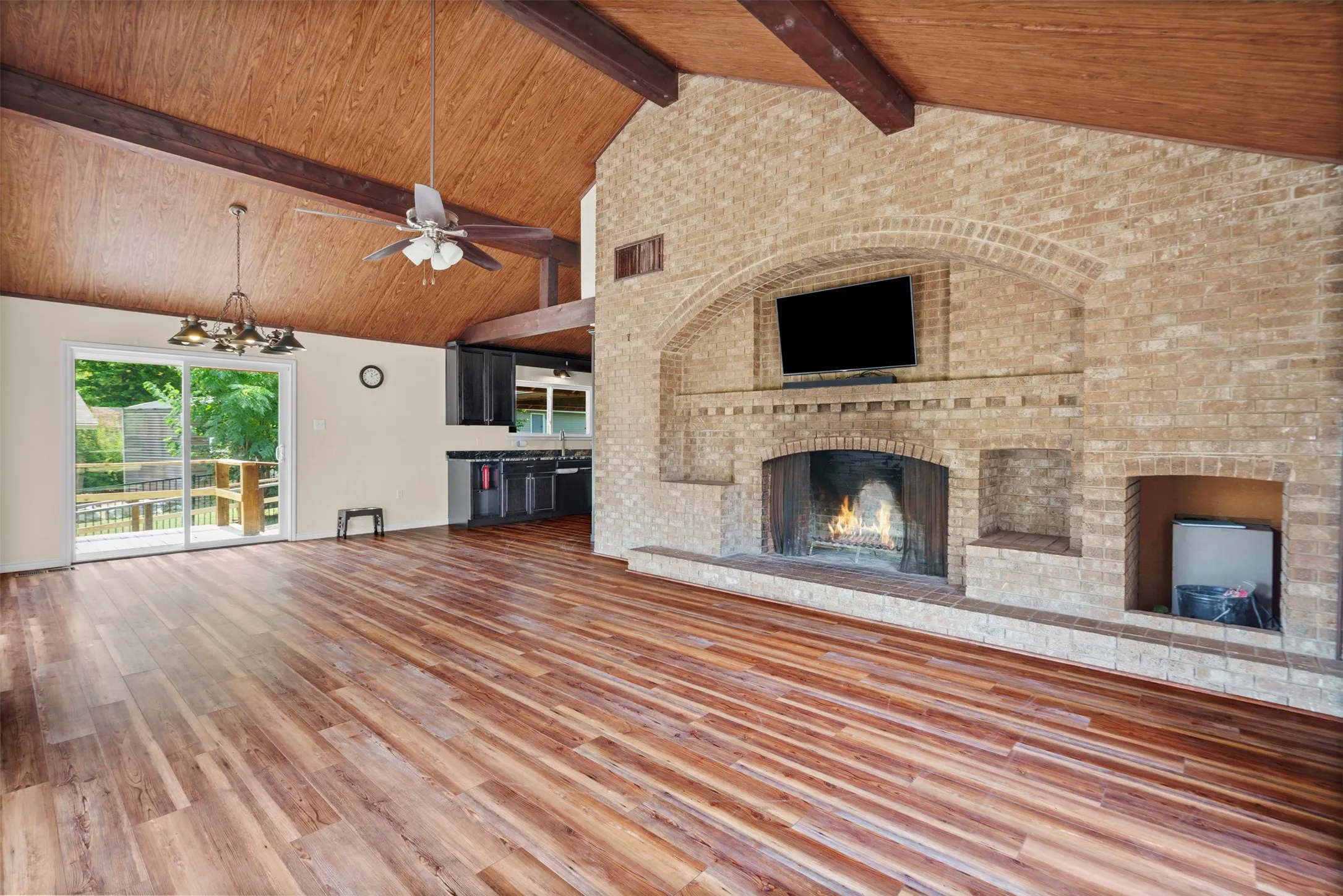 Vaulted wood-paneled ceiling with exposed beams