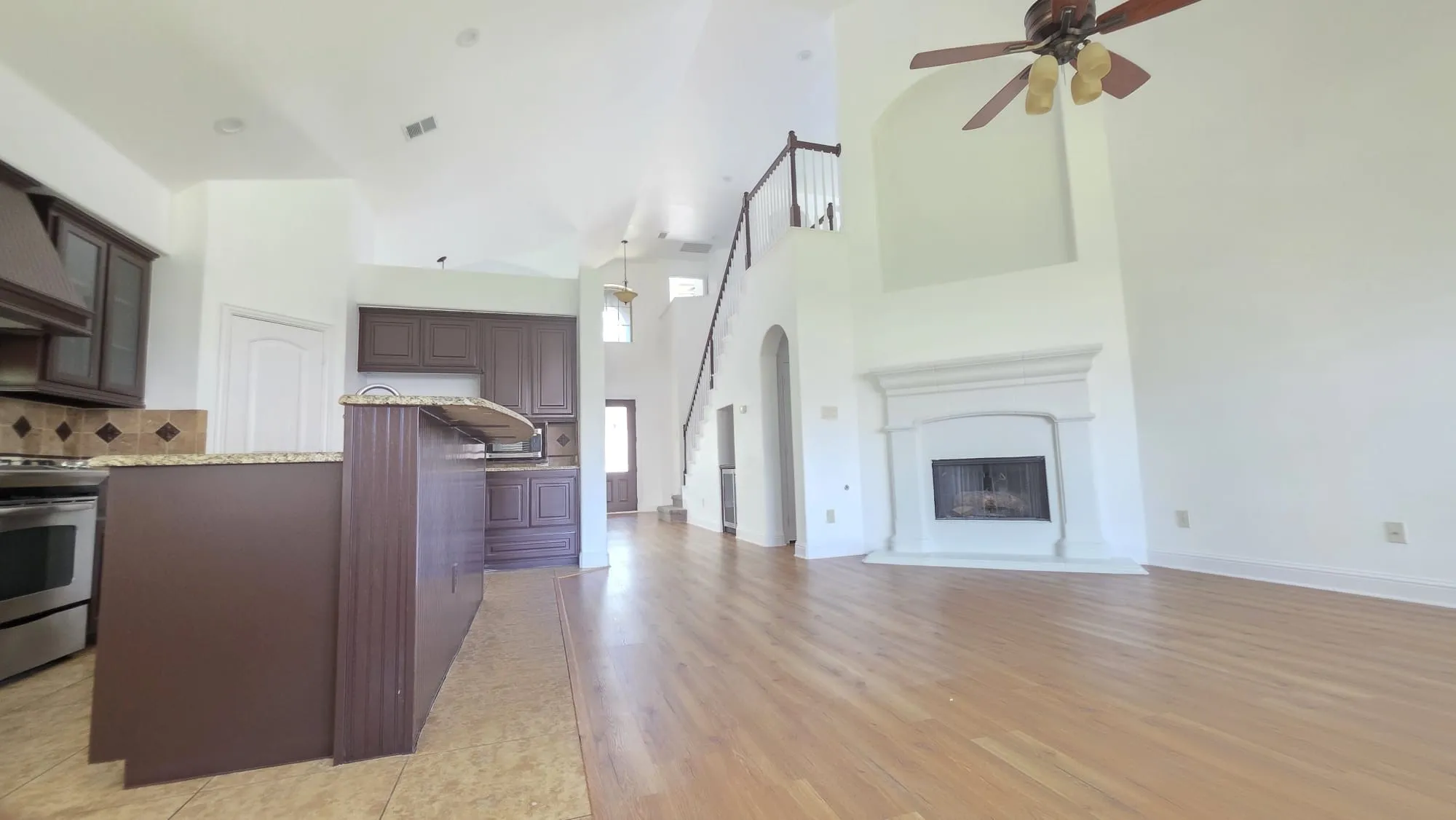Soaring ceilings in Family room with fire place