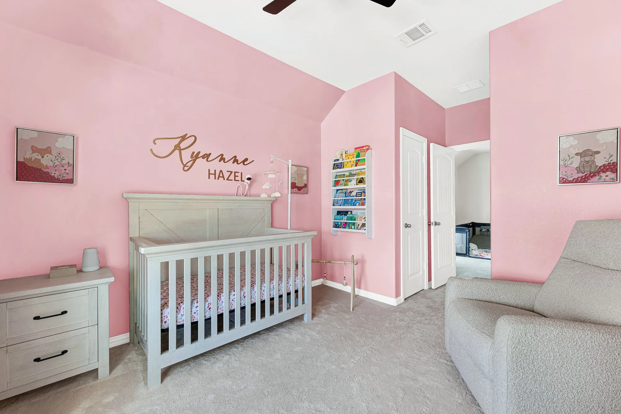 Carpeted room featuring a ceiling fan, white baseboards, and a pair of white panel doors