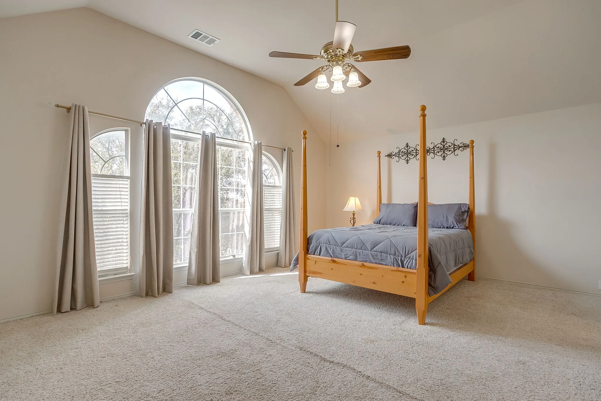 The primary bedroom is generously sized and has plenty of room for a sitting area or office nook.