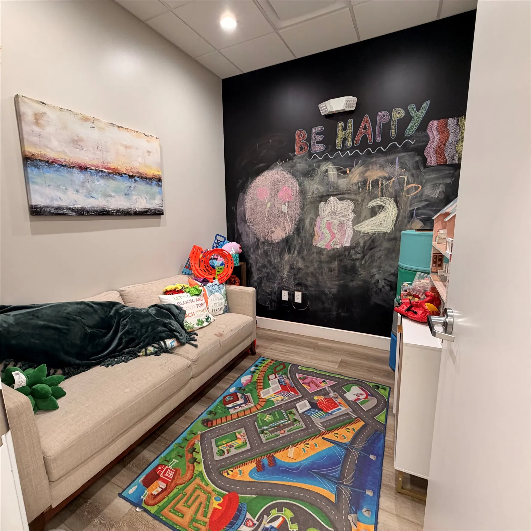 Feature wall with chalkboard paint and recessed lighting