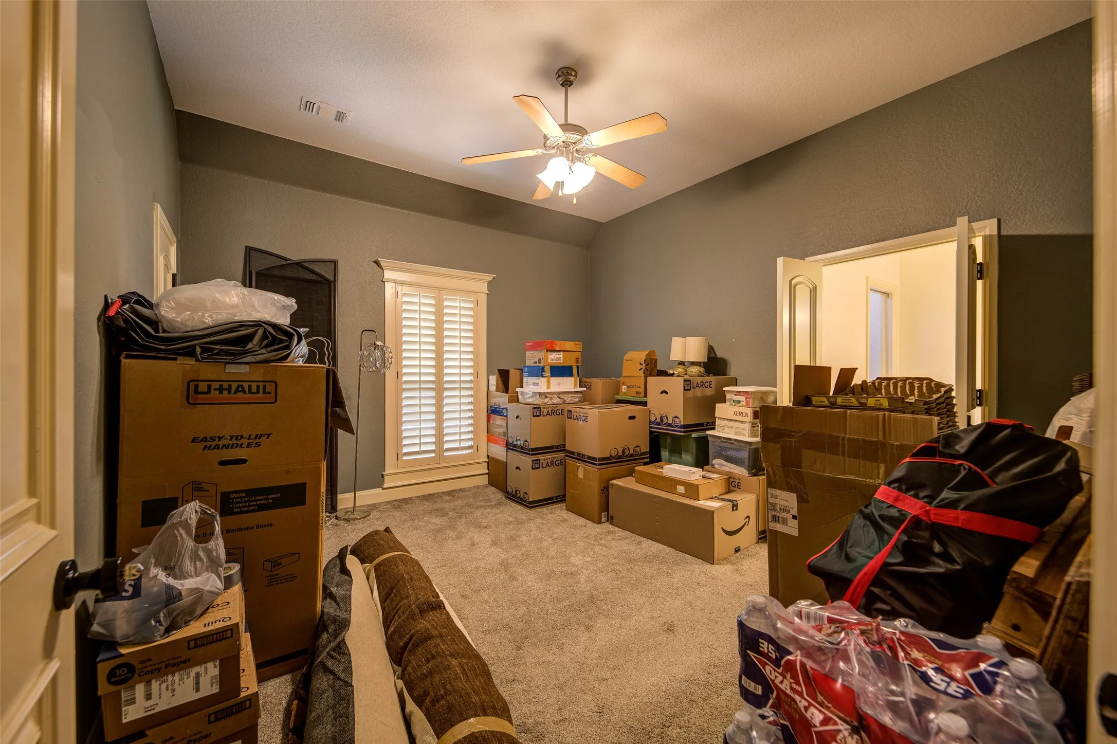 Bedroom 3 featuring a ceiling fan with light fixture, crown molding, and neutral wall paint