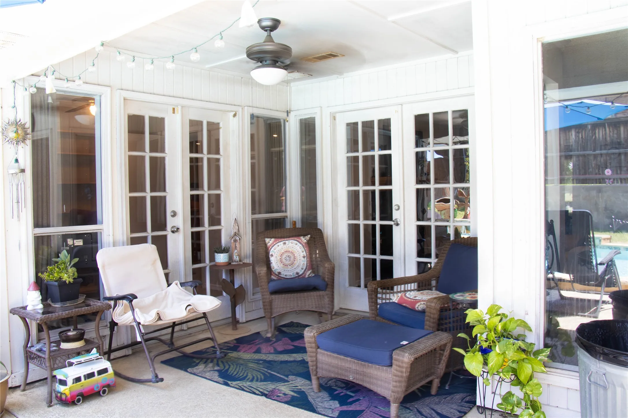 SHADED AREA OVERLOOKING THE POOL AND BACKYARD