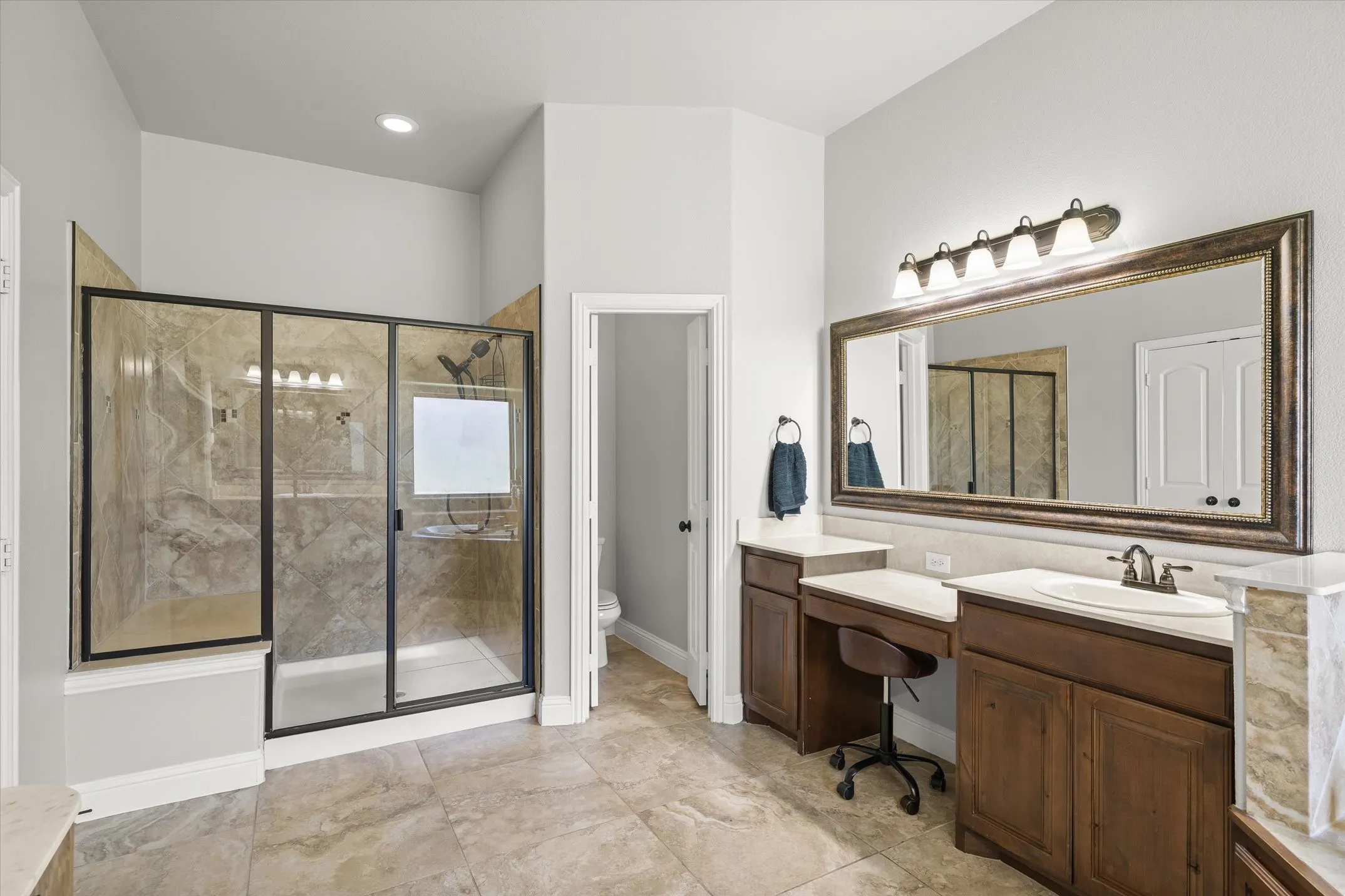 Separate shower in the primary bathroom at 413 Cattle Barron Drive, Rockwall, Tx, Rockwall County, Chisholm Crossing