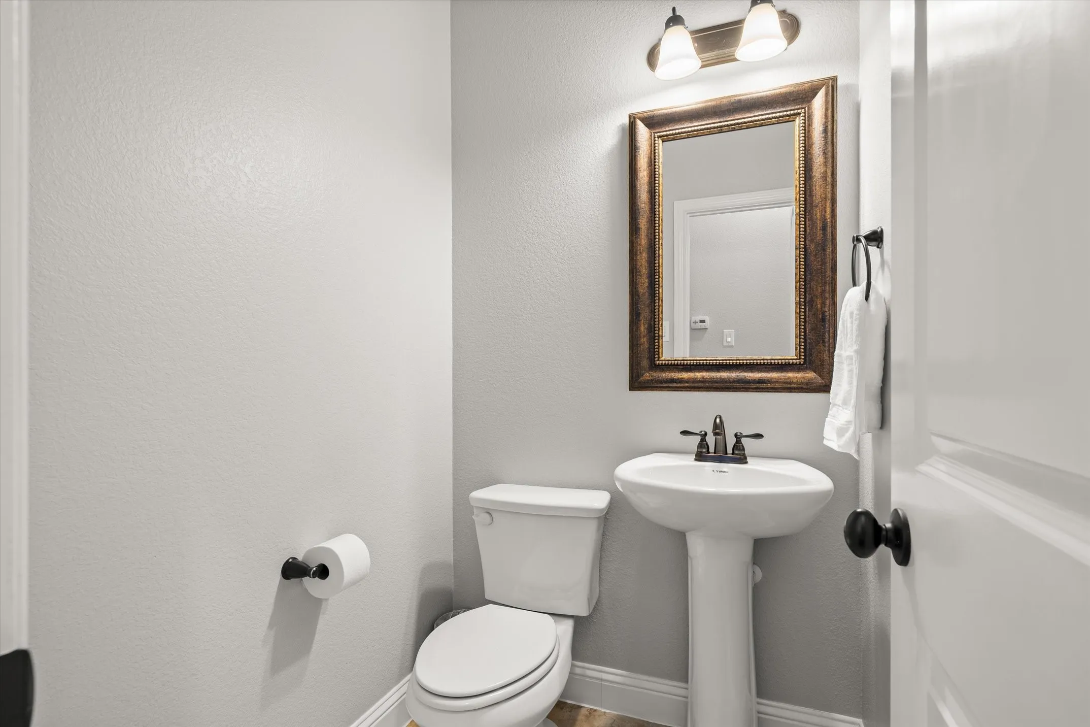 Guest half bath in the back hallway at 413 Cattle Barron Drive, Rockwall, Tx, Rockwall County, Chisholm Crossing