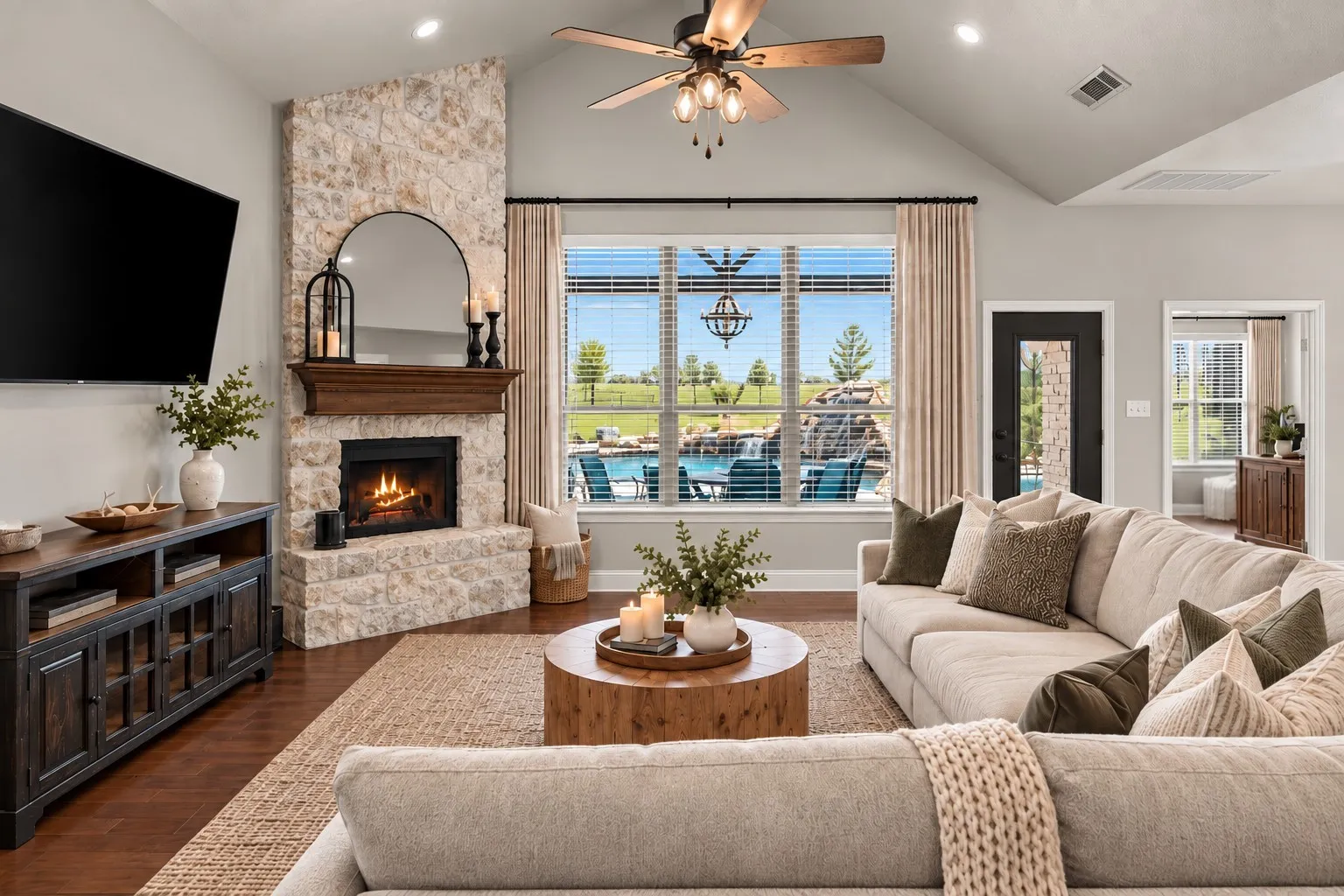 Living Room overlooking the saltwater pool at 413 Cattle Barron Drive, Rockwall, Tx, Rockwall County, Chisholm Crossing. Virtual staging utilized.