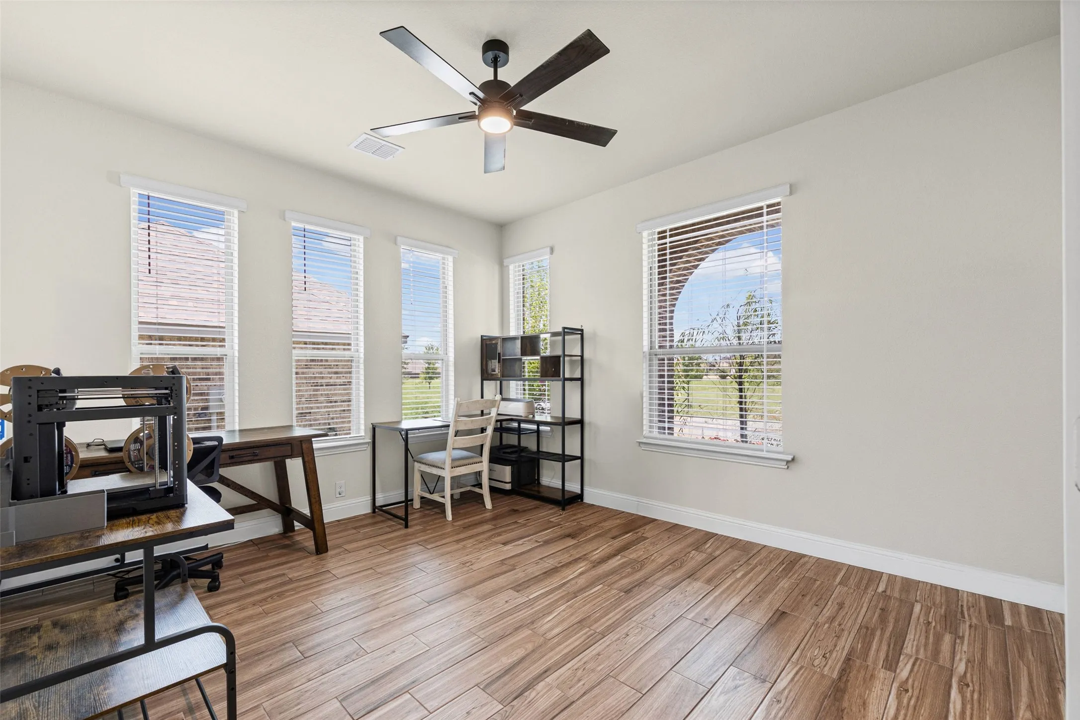Office at the front of the home with lots of windows