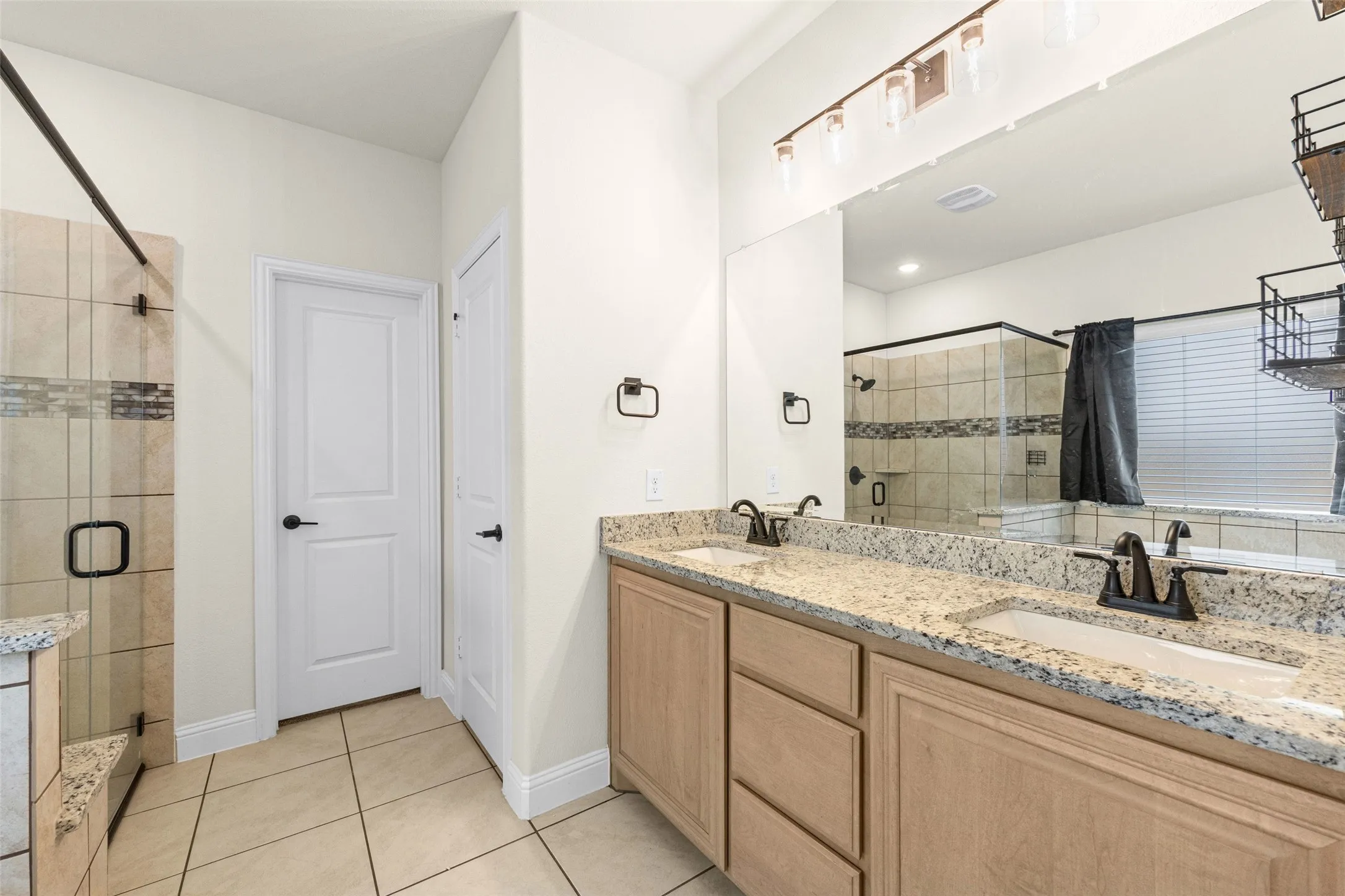 Primary bathroom has separate tub and shower and double sinks