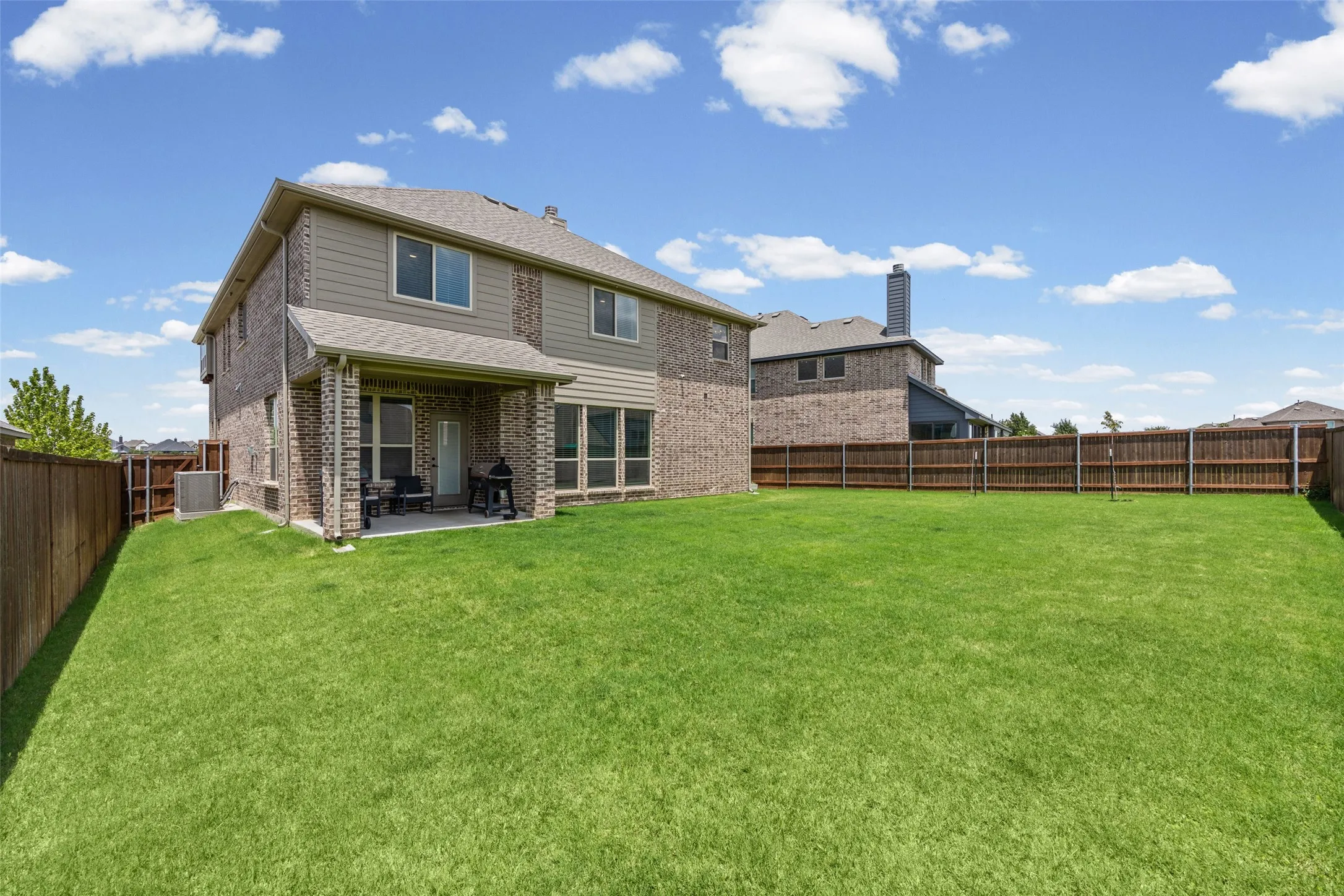 Large backyard with covered patio