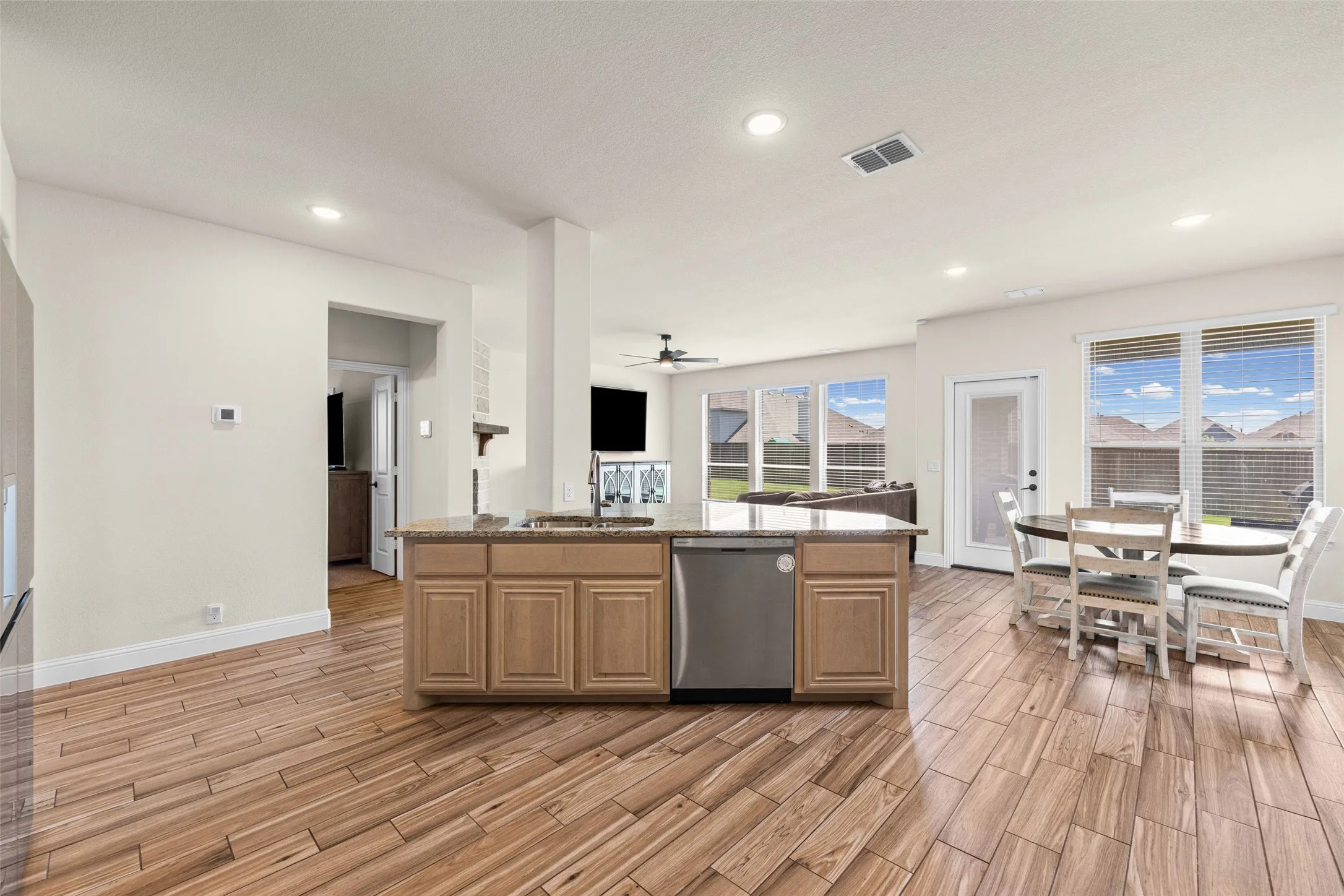 Huge kitchen with stainless appliances, granite counters, island, gas cooktop, and so many cabinets!
