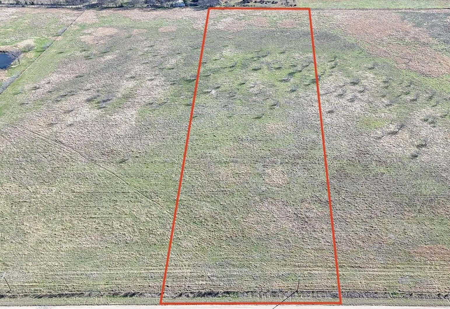 Expansive undeveloped acreage featuring varied topography and natural vegetation