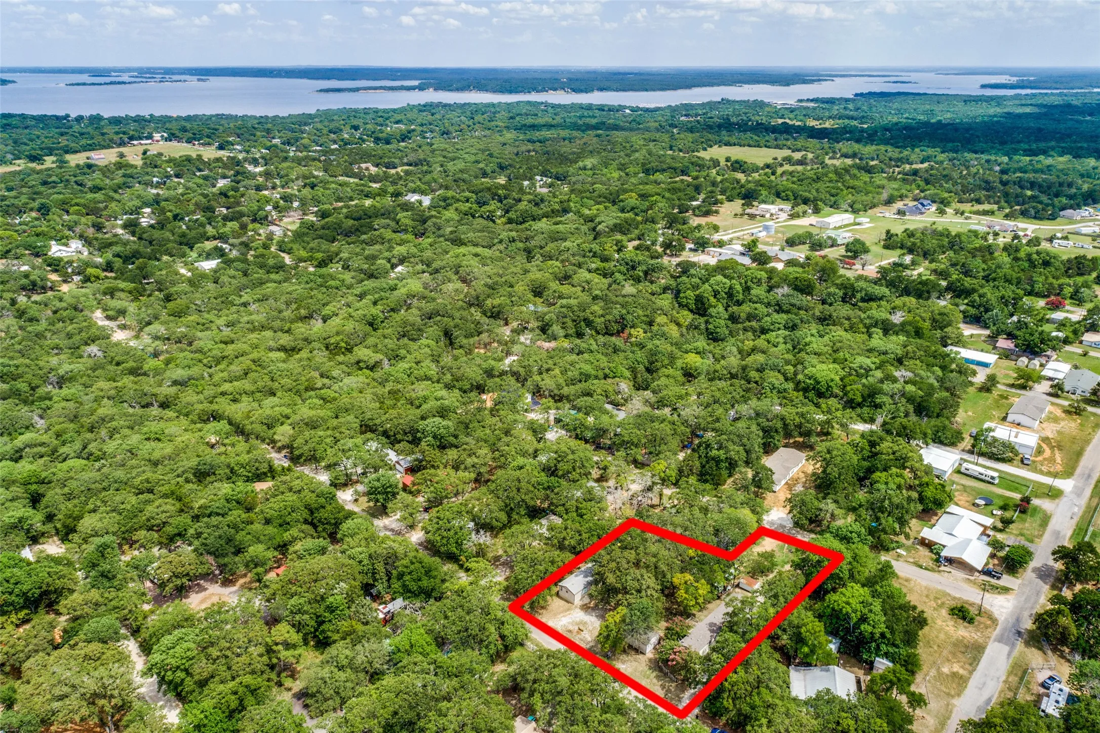 Birds eye view of property featuring a water view of Lake Texoma