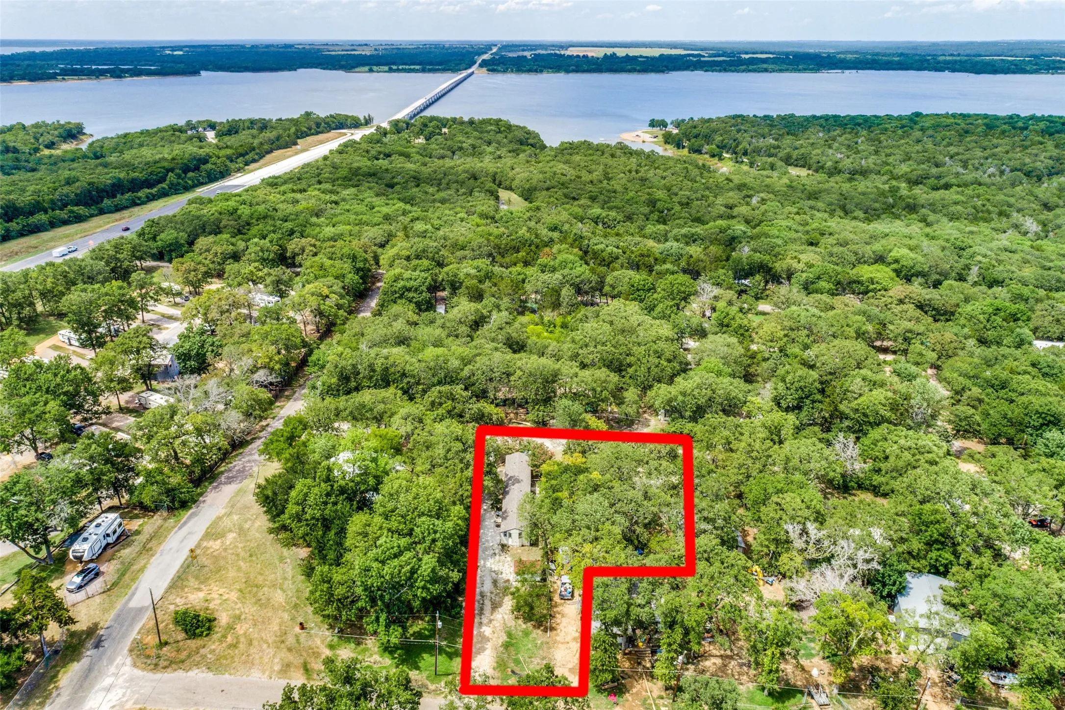 Aerial view featuring nearby Lake Texoma, beaches, campsites, and boat ramp.