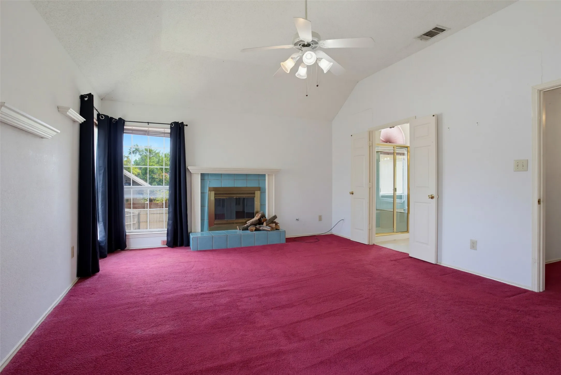 More than enough room for a sitting area near the fireplace before you hop in your big Kingsize Bed!