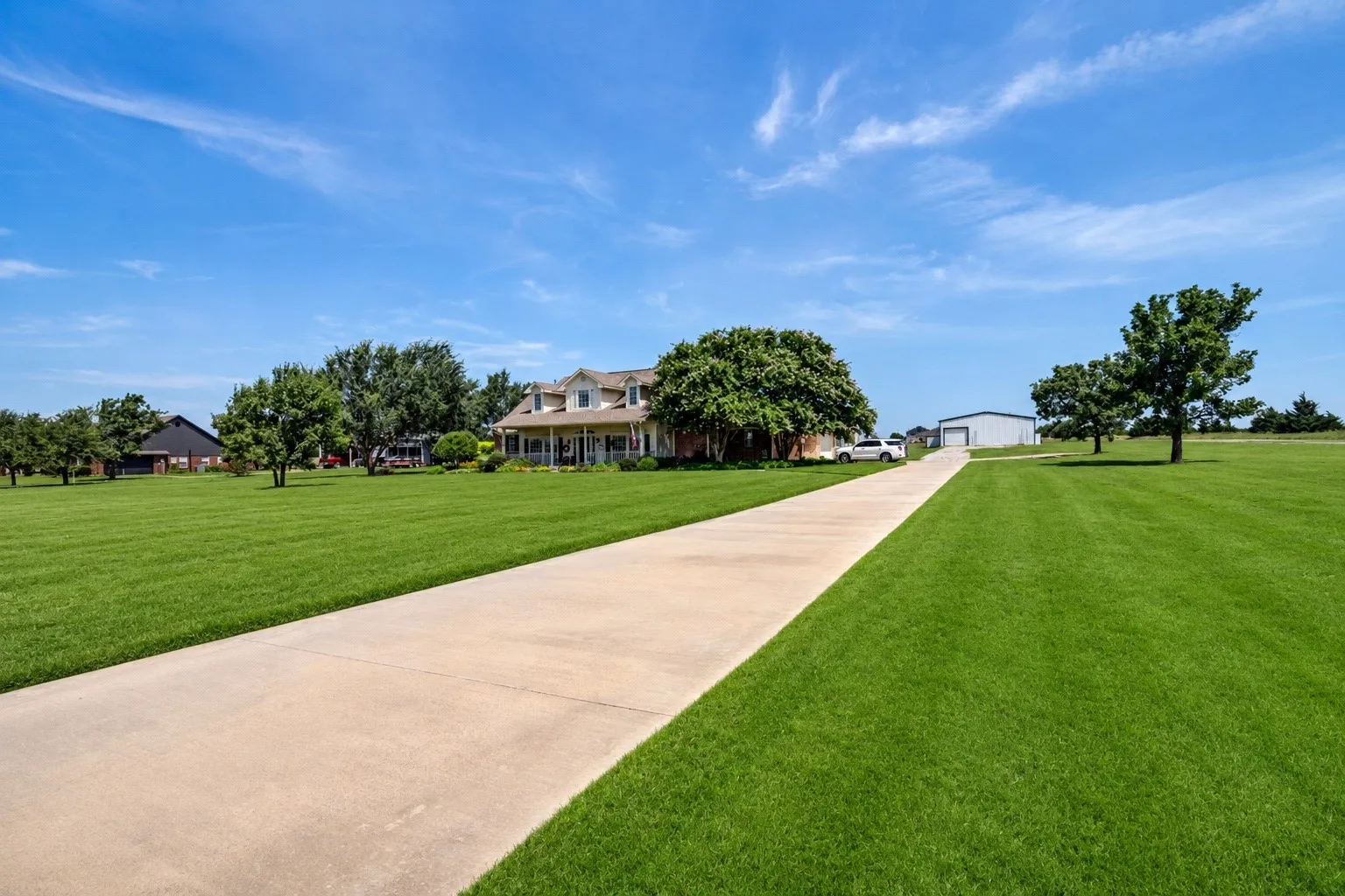 Long driveway with extra parking or turn around at the end.
