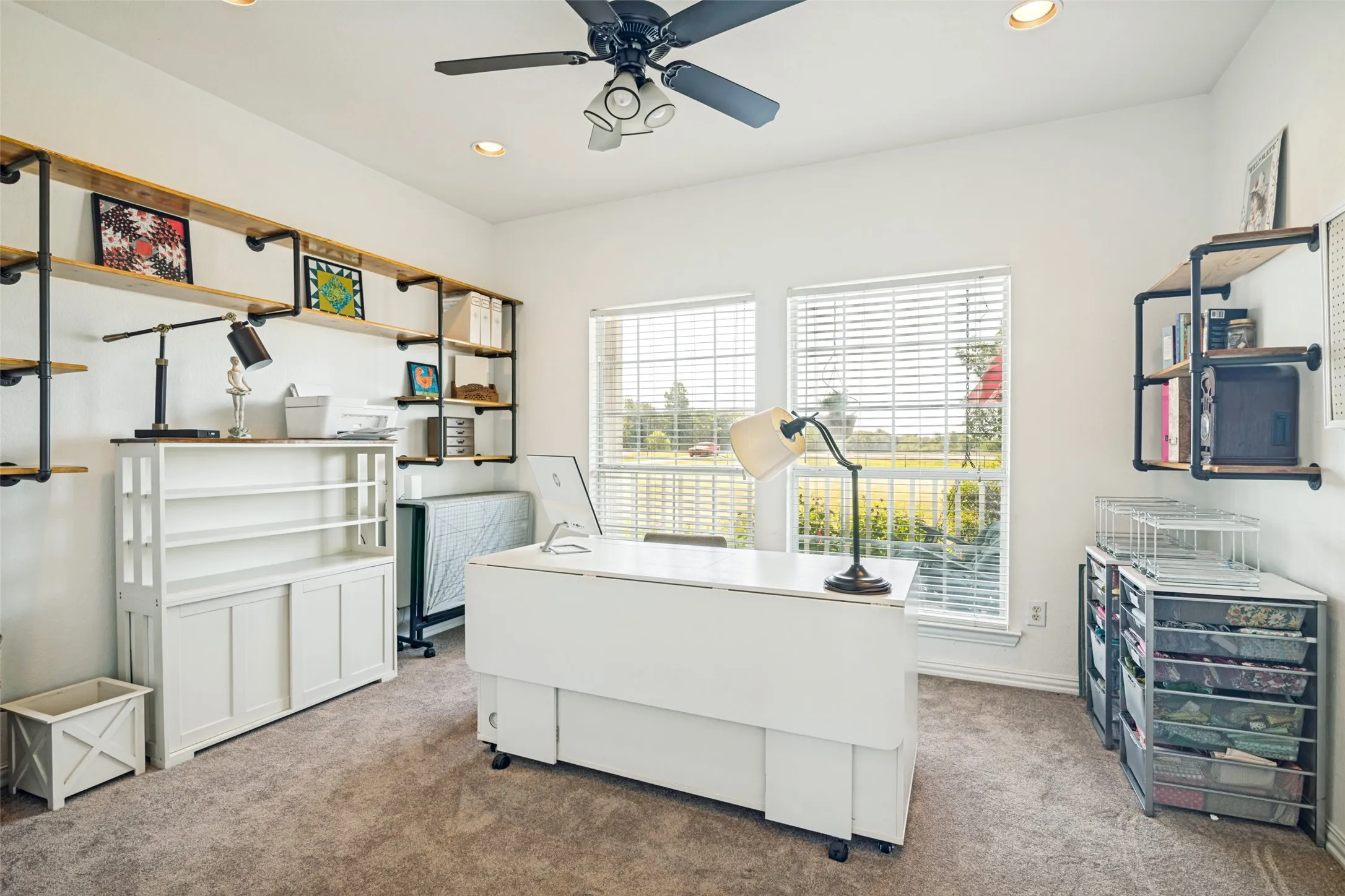 Secondary bedroom being used as a home office and craft room.  Shelves will stay.