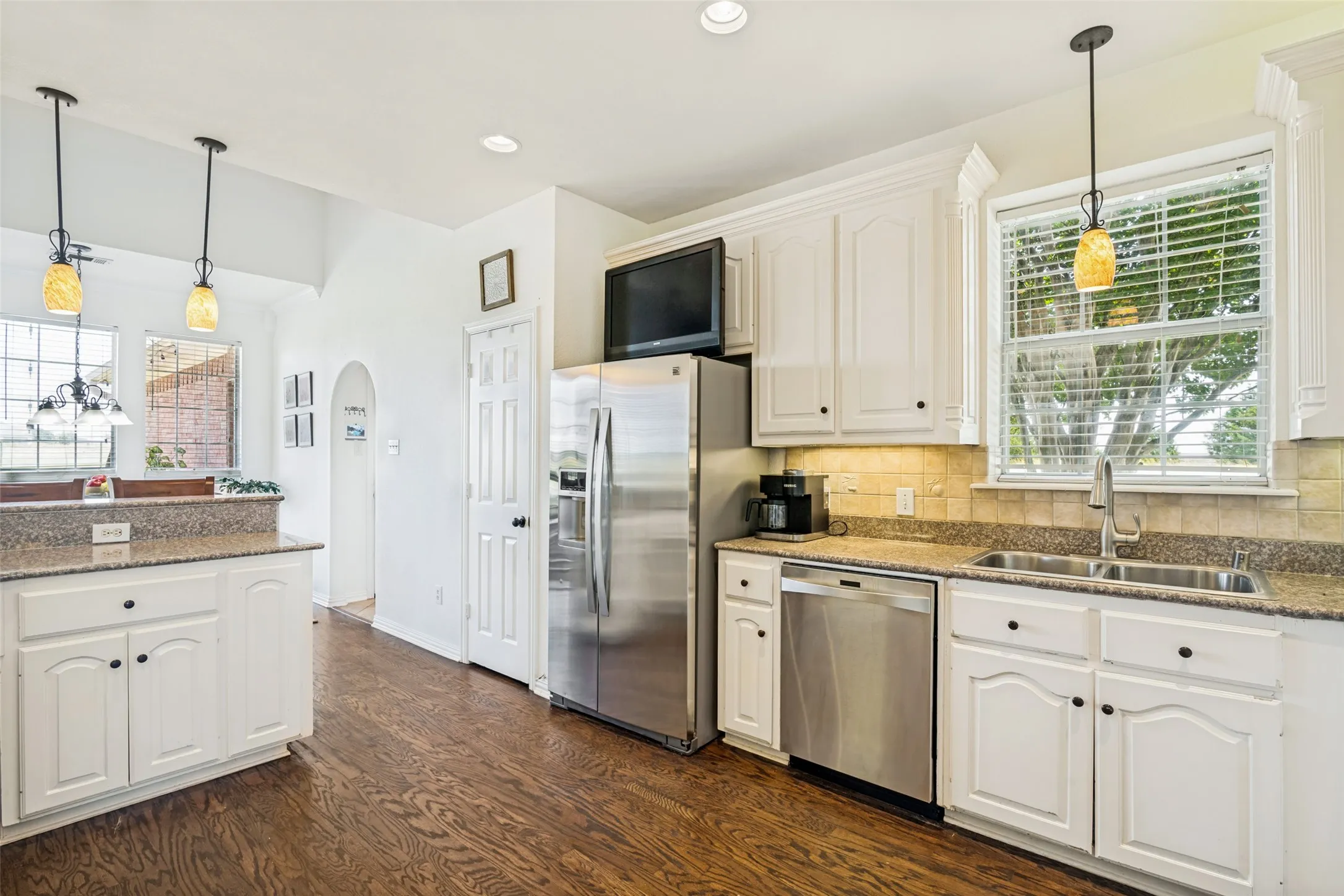 Lots of cabinet space and natural light in the kitchen.