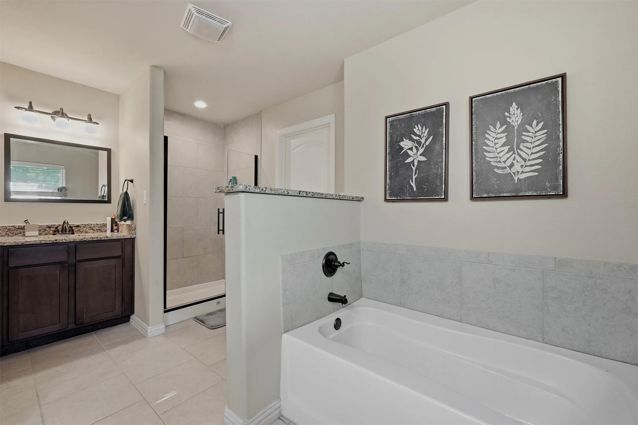 See, there are two sinks along with a shower and a tub!