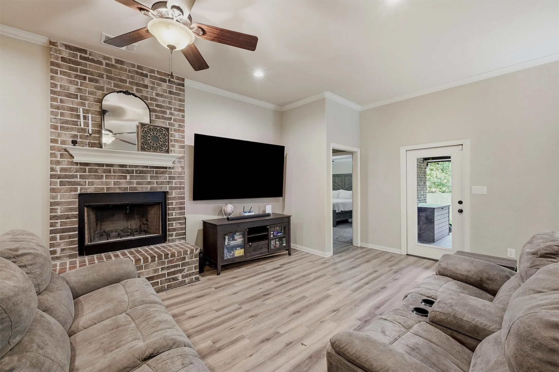 Crown molding from top to bottom; and look at that wood burning fireplace!