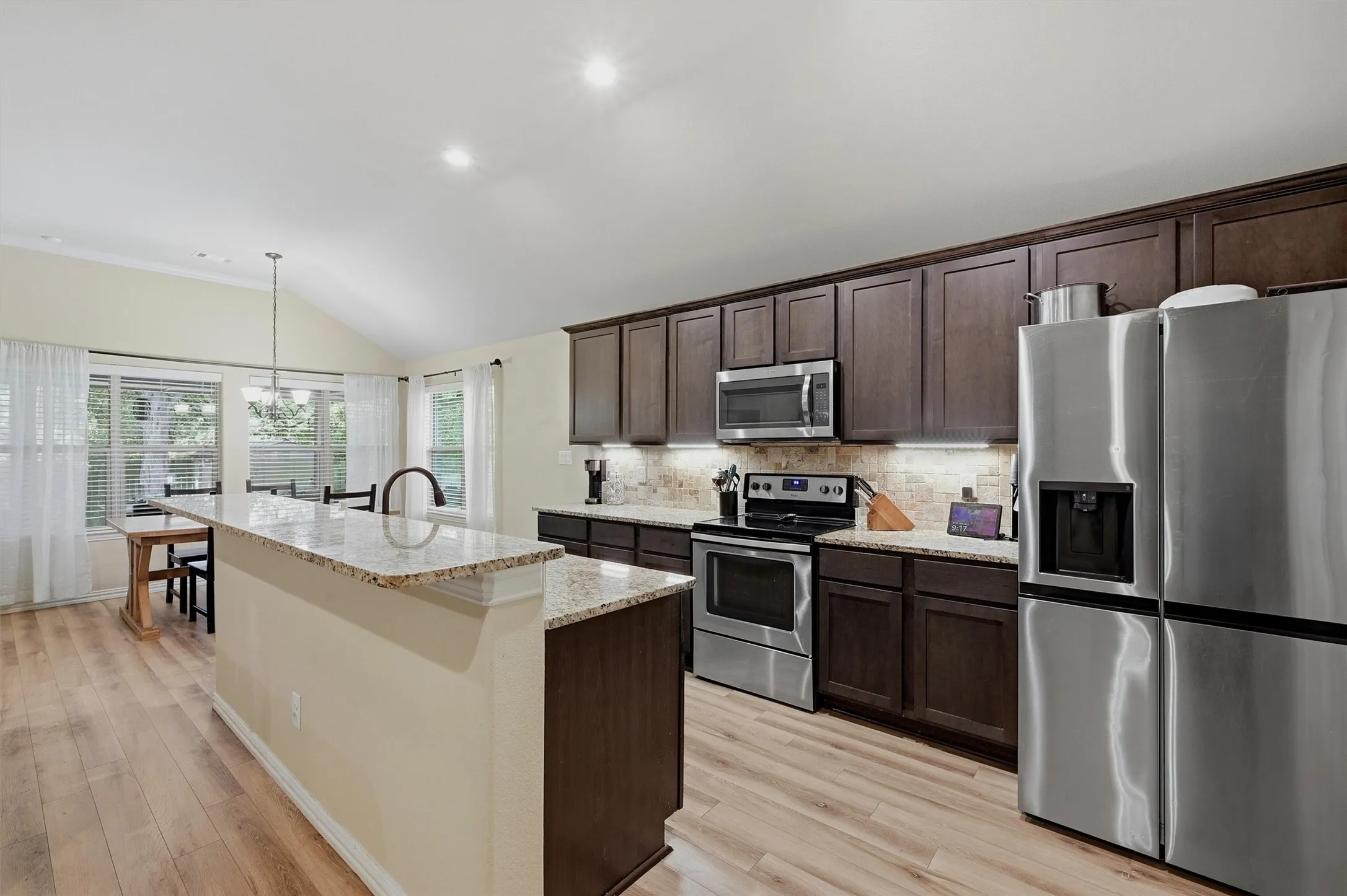 Look at those granite countertops and the backsplash.
