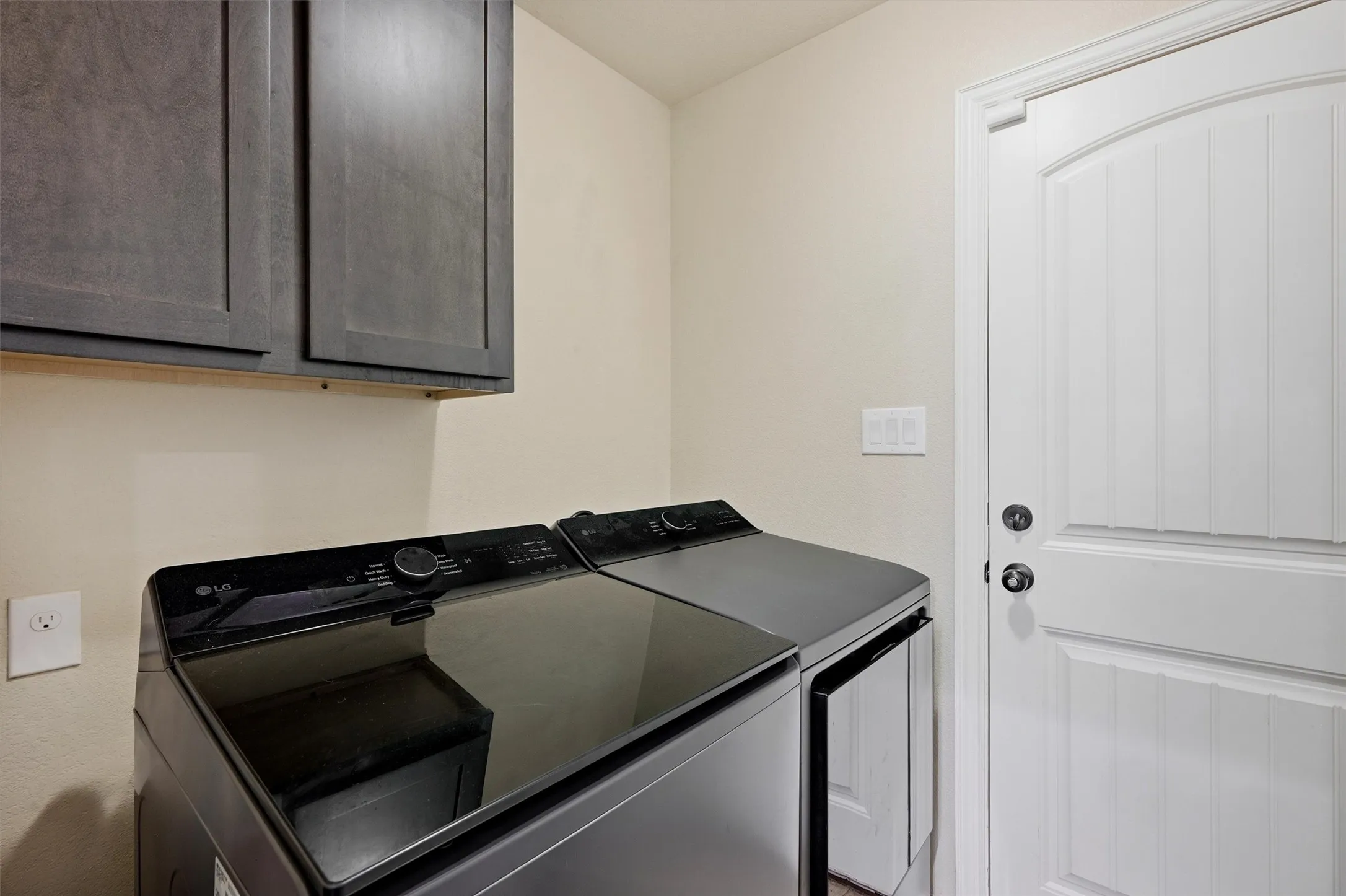 The laundry room has a door to the garuage and another door that closes it off from the kitchen.