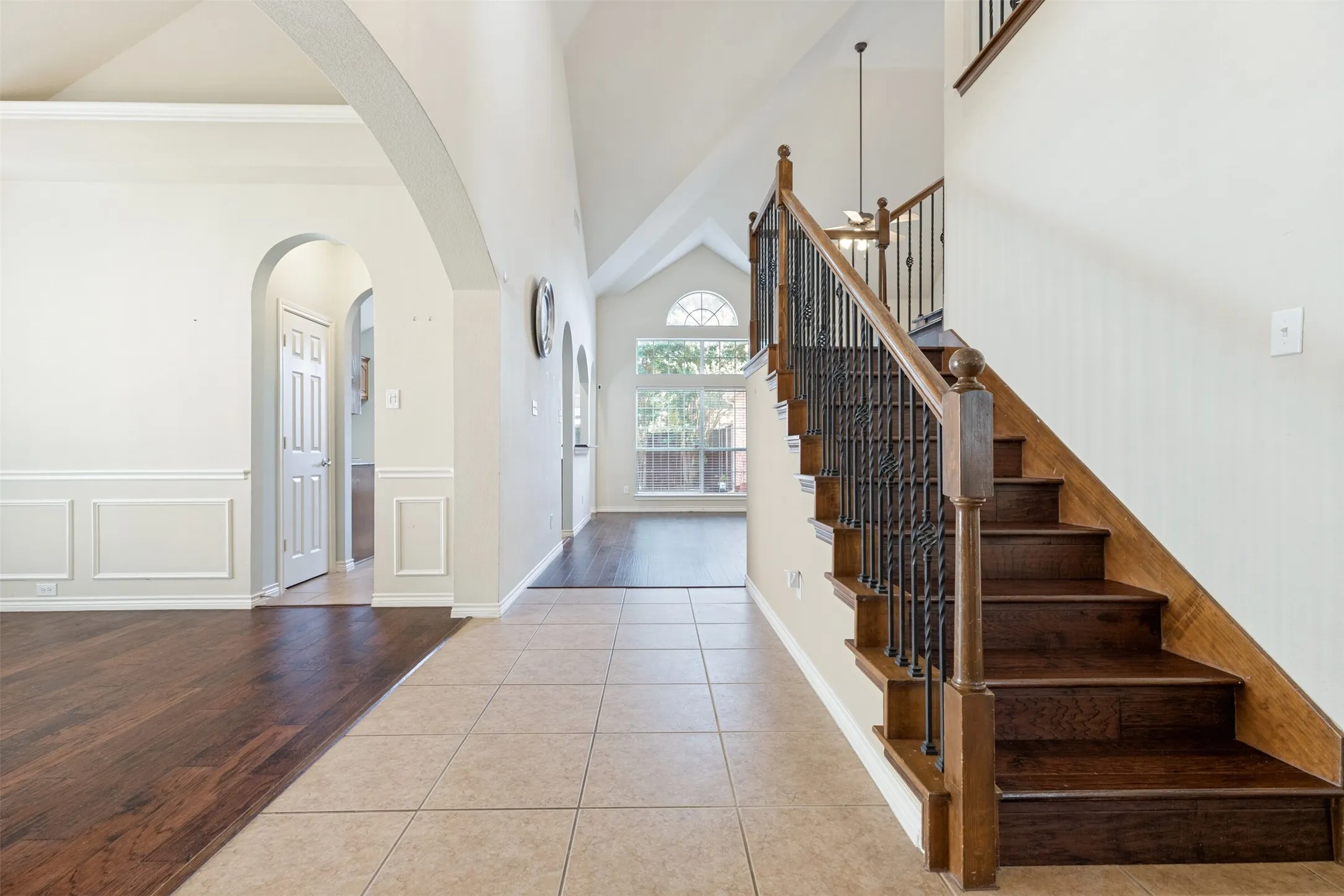 Two-story entry with iron baluster staircase